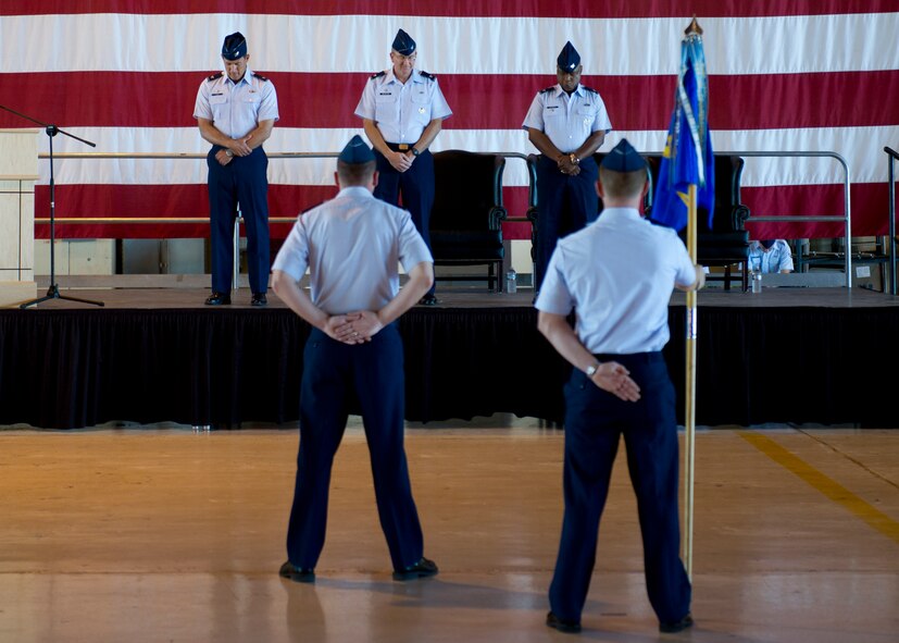 HOLLOMAN AIR FORCE BASE, N.M. -- Col. David Krumm, 49th Wing commander, Col. Donald Van Patten, former 49th Maintenance Group commander, and Col. André Kennedy, 49th MXG commander, bow their heads during the invocation at the 49th MXG Change of Command July 11, 2011, in Hangar 301.(U.S. Air Force photo by Senior Airman John D. Strong II/Released)