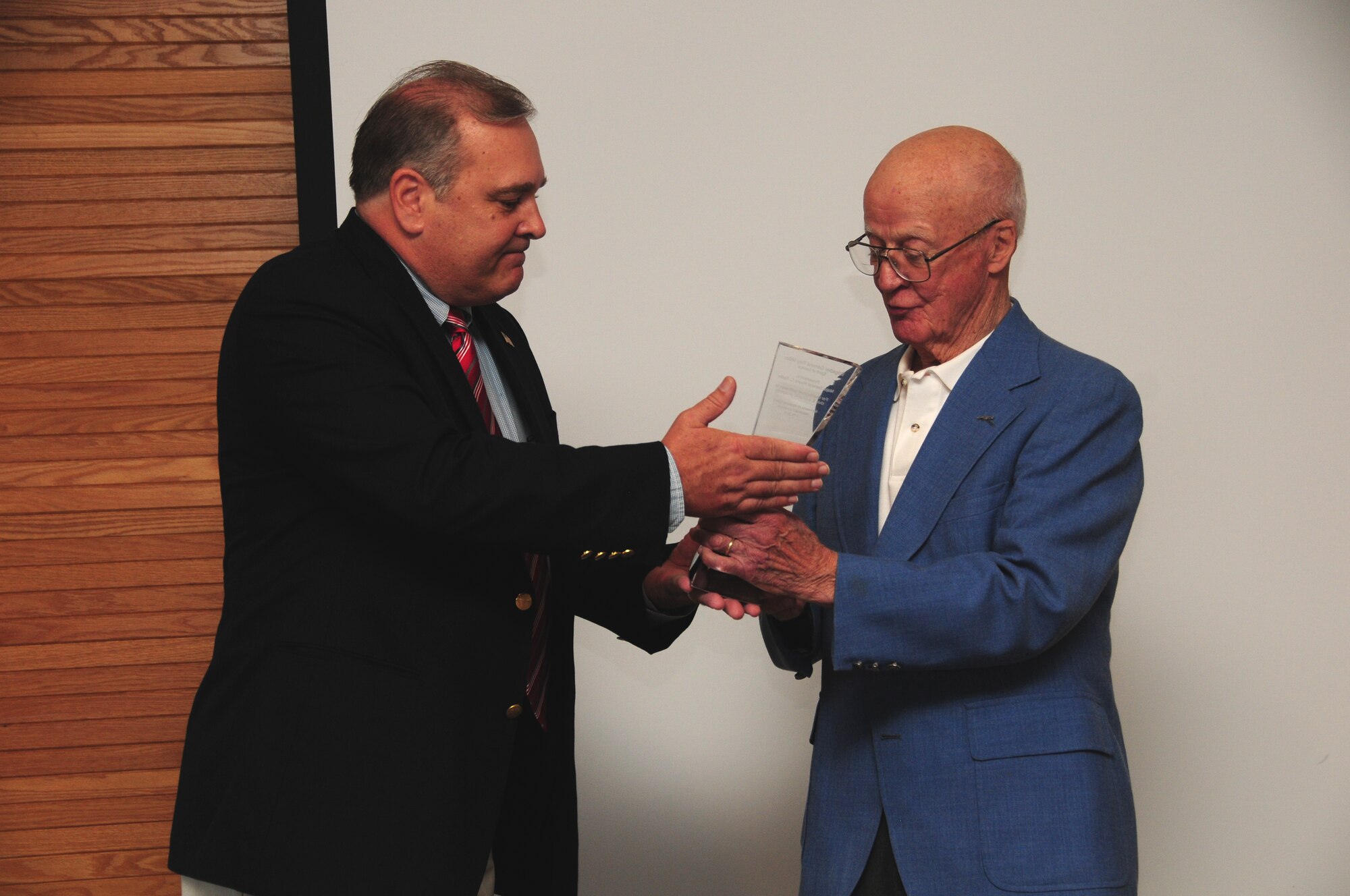 Maj. Gen. Wayne Gatlin (Ret.), former 148th Fighter Wing Commander was awarded the Brig. Gen. Ray Miller Spirit of Service Award by Brig. Gen. Mark Ness (Ret.) during a luncheon held at the 148th Fighter Wing.  The luncheon was in honor of the Minnesota Air National Guard's Anniversary.  (U.S. Air Force photo by Master Sgt. Ralph Kapustka/released)