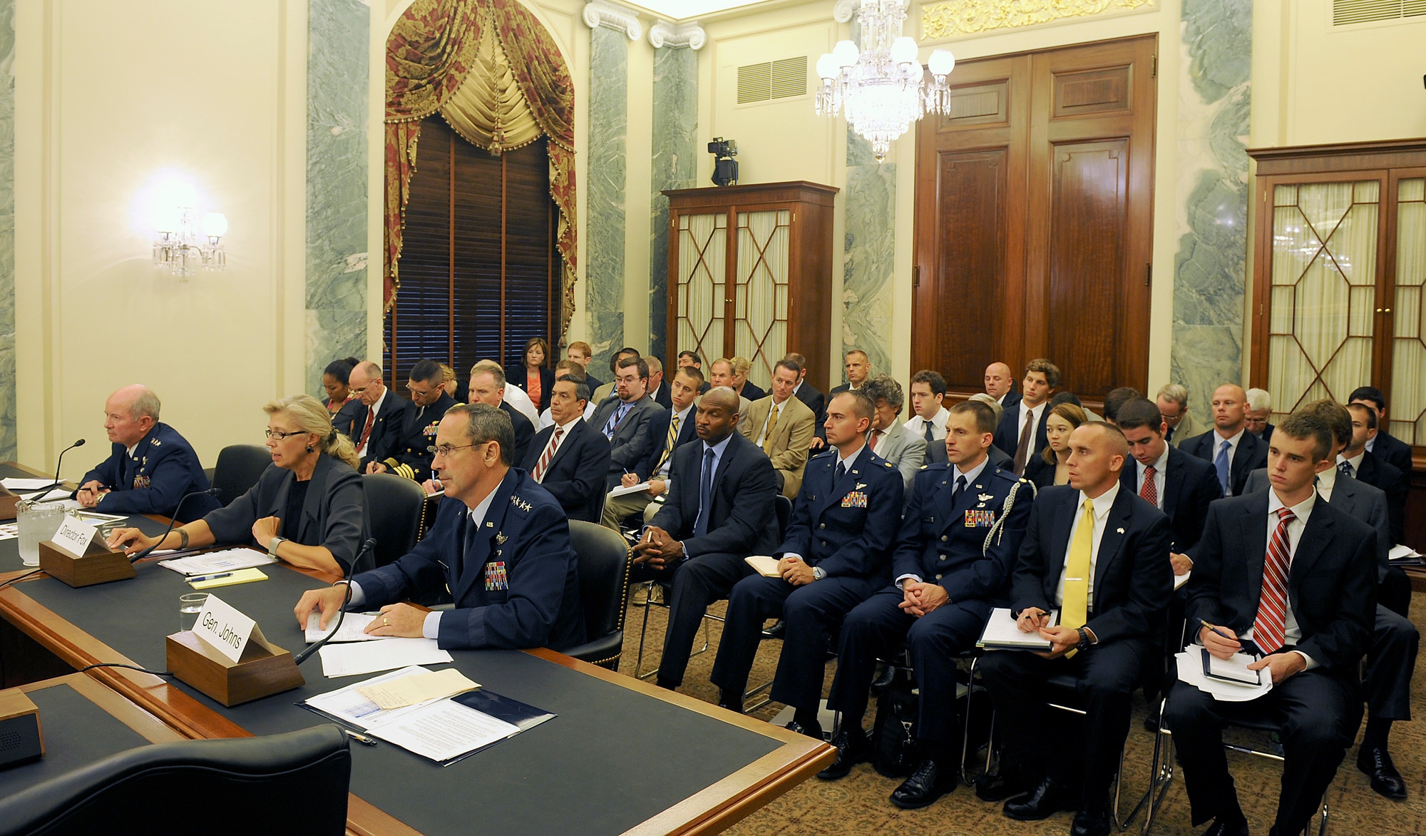 Department of Defense and military officials testified before the Senate Armed Services Subcommittee on Seapower in Washington, D.C., July 13, 2011. Testimony included the budget request to lower the 316 strategic airlift floor to 301 aircraft at a cost savings of more than $1.2 billion in taxpayer dollars across the Future Years Defense Plan. Seated from right are Gen. Raymond Johns, the Air Mobility Command commander; Christine Fox, the Department of Defense Cost Assessment and Program Evaluation director; and Gen. Duncan McNabb, the U.S. Transportation Command commander.  (U.S. Air Force photo/Scott M. Ash)