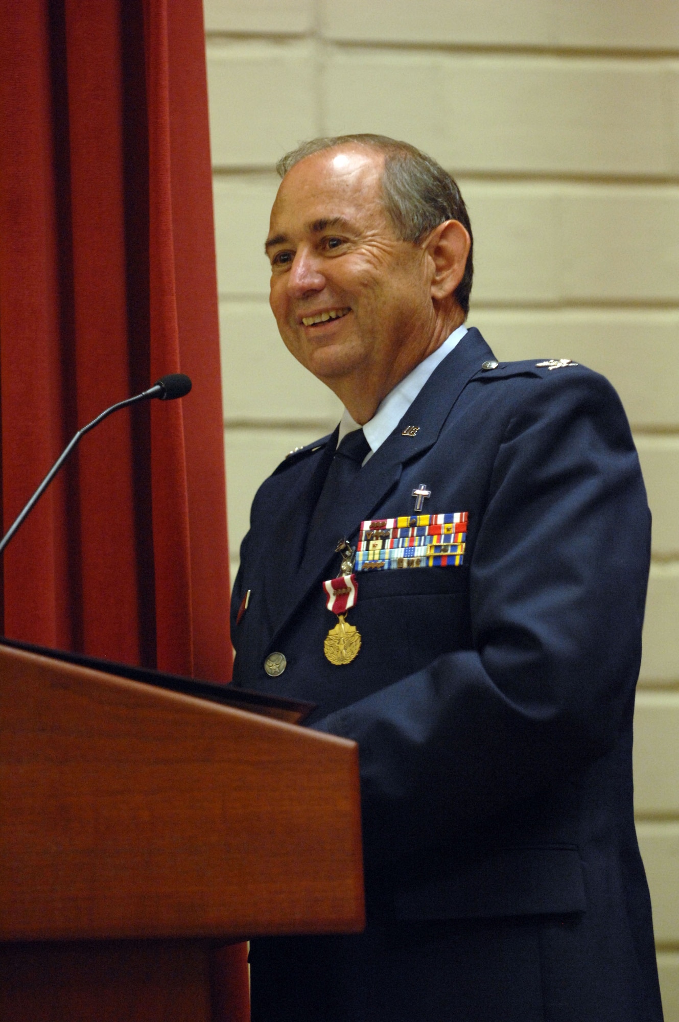 Chaplain (Col.) Raymond L. Hagan, 4th Air Force Senior Staff Chaplain, addresses the audience during his retirement ceremony at March Air Reserve Base, Calif., July 9, 2011.  Hagan retired after more than 24 years of service as a chaplain in the U.S. Air Force.  (U.S. Air Force photo/Staff Sgt. Sean Adams)