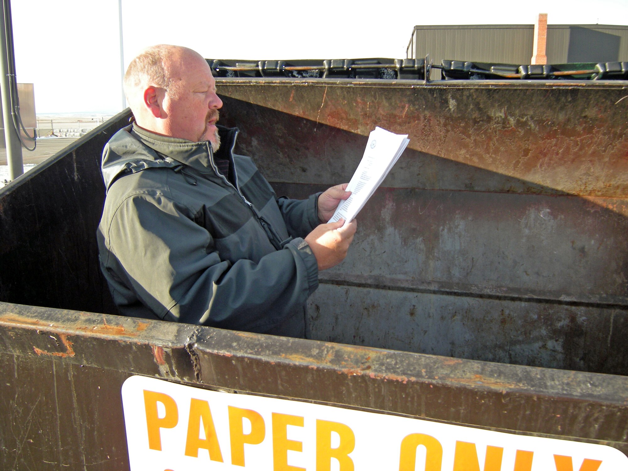 Victor Duckarmenn, 21st Space Wing Operational Security program manager, goes dumpster diving to make sure there is no personal or classified information being thrown away. (Courtesy photo)