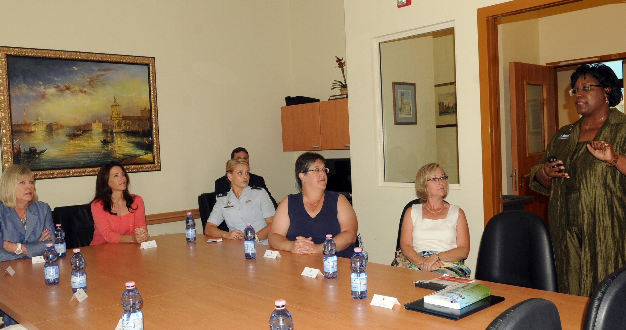 Gwen Lee, the Airman Family Readiness Center director, briefs Suzie Schwartz (left), wife of the Air Force Chief of Staff Gen. Norton Schwartz, July 11, 2011, on various programs for spouses at Aviano Air Base, Italy.  The general and his wife were visiting Aviano to meet with Airmen and their families and observe the installation’s mission. (U.S. Air Force photo/Airman Briana N. Jones)
