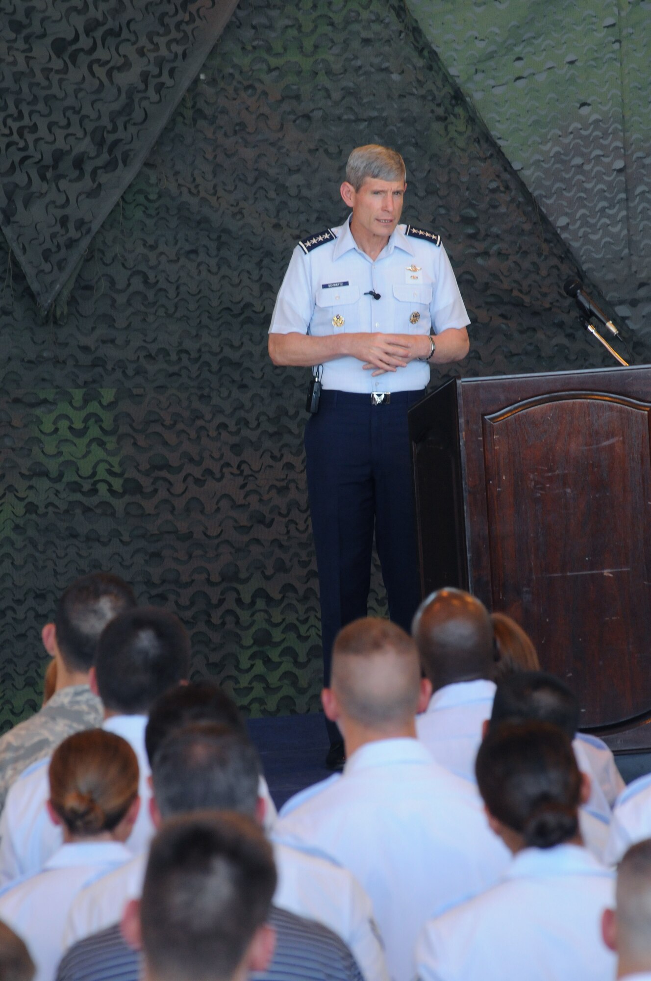 Air Force Chief of Staff Gen. Norton Schwartz addresses Airmen during an all call at Aviano Air Base, Italy, on July 11, 2011. The general and his wife Suzie were visiting Aviano to meet with Airmen and their families and observe the installation’s mission. During his remarks, the general praised 31st Fighter Wing personnel for their achievements in operations, deployments and inspections. (U.S. Air Force photo/Airman LaVel D. Sterling)