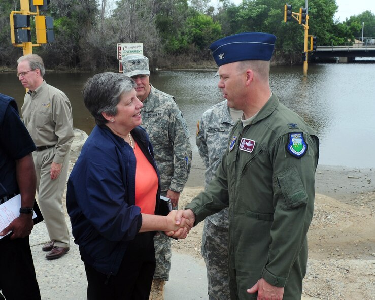 MINOT, N.D. -- Secretary of Homeland Security Janet Napolitano speaks with Col. S.L. Davis, 91st Missile Wing commander about military specific issues during her visit here July 13. Secretary Napolitano visited Minot after the recent flooding of the Souris River, which displaced families including more than 1,100 Airmen from Minot Air Force Base, N.D. Colonel Davis represented the base during a meeting with state and local officials at Minot city hall. (U.S. Air Force photo/Senior Airman Michael J. Veloz)