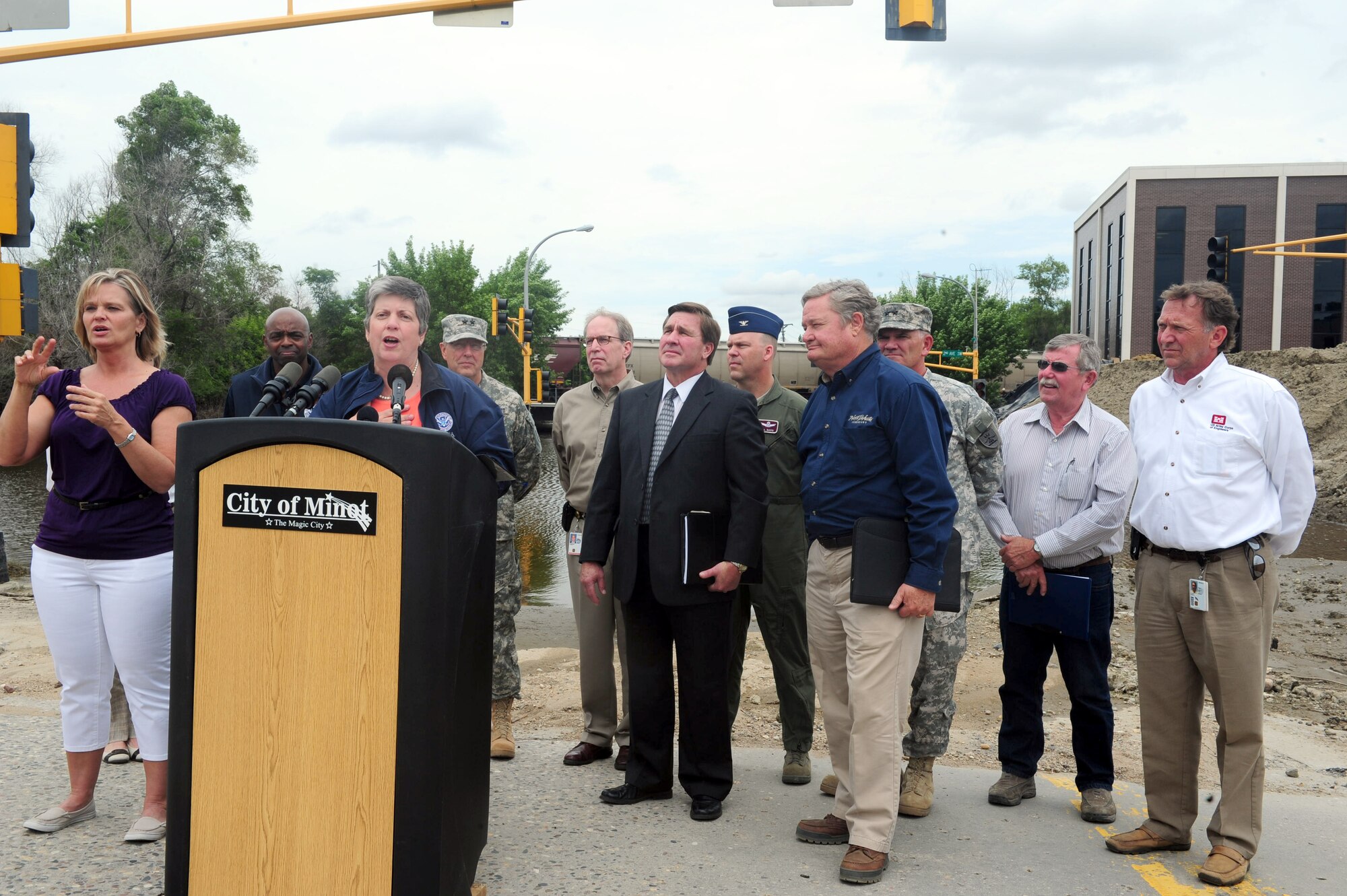MINOT, N.D. -- Secretary of Homeland Security Janet Napolitano speaks at a news conference during her visit here July 13. Secretary Napolitano visited Minot after the recent flooding of the Souris River, which displaced families including more than 1,100 Airmen from Minot Air Force Base, N.D. Col. S.L. Davis, 91st Missile Wing commander, represented the base during a meeting with state and local officials at Minot city hall. (U.S. Air Force photo/Senior Airman Michael J. Veloz)