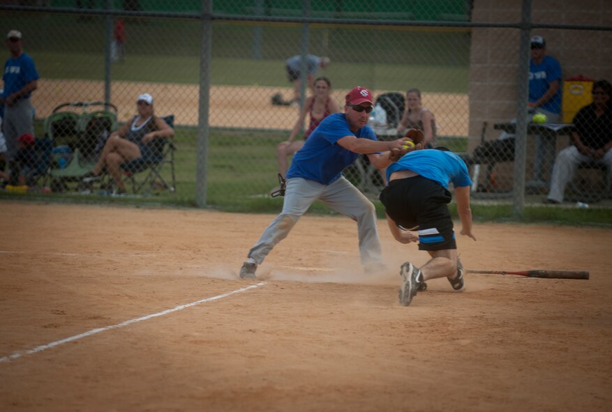 James Roberts, 23rd Comptroller Squadron, stops a run at home plate during a tournament game at Moody Air Force Base, Ga., July 13, 2011. The 23rd Wing will play in the finals for a chance to be crowned champions after gaining this victory. (U.S. Air Force photo by Airman 1st Class Joshua Green/Released)

