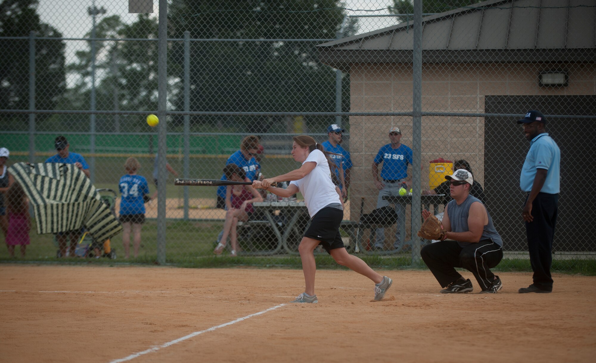 Kenzi Pewitt, 23rd Wing command post, hits a ball to short stop her fist time up to bat during a tournament game at Moody Air Force Base, Ga., July 13, 2011. Although it was a solid hit, Pewitt was called out at first but got another player to third base. (U.S. Air Force photo by Airman 1st Class Joshua Green/Released)
