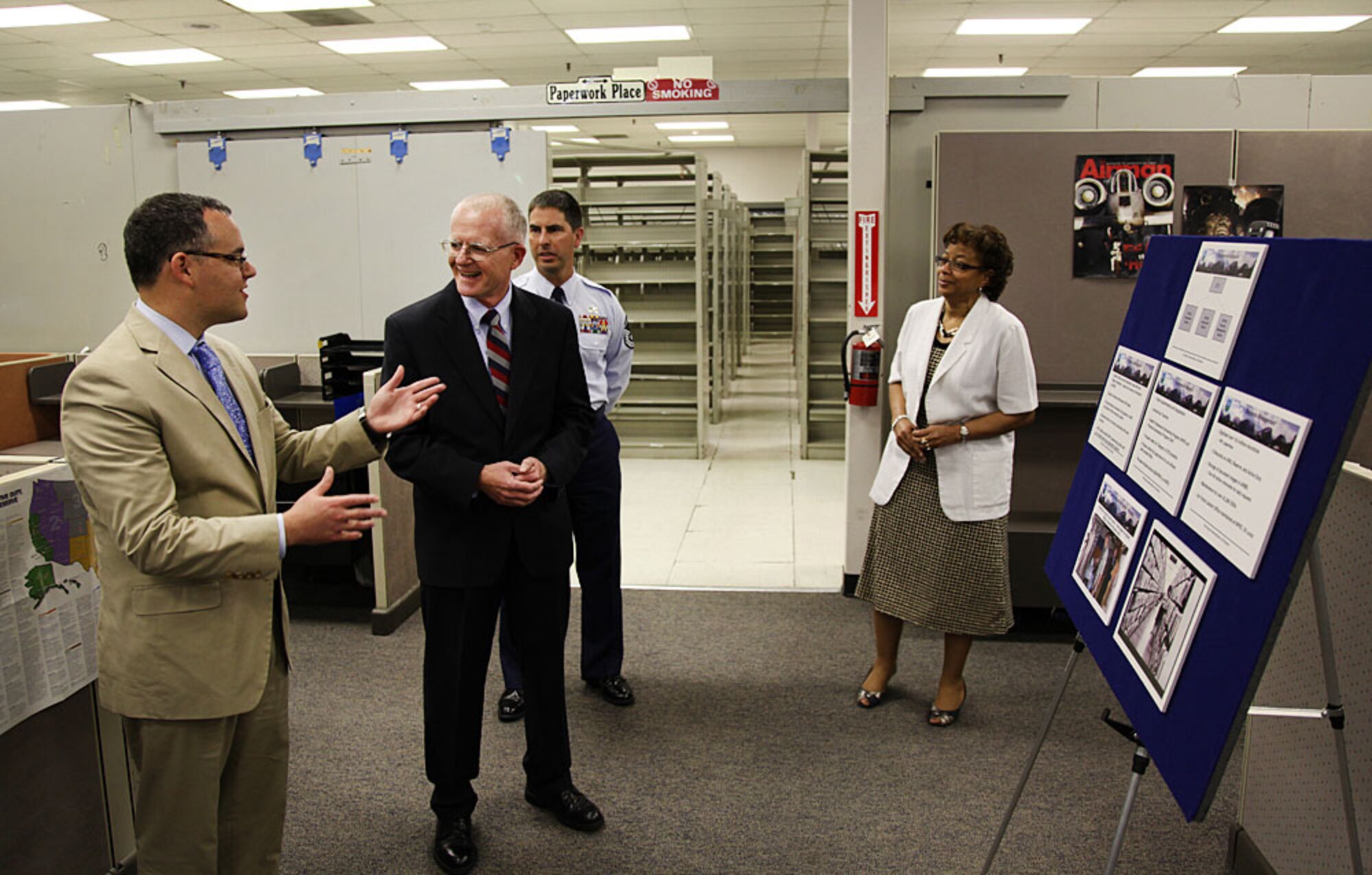 Assistant Secretary of the Air Force for Manpower and Reserve Affairs Daniel B. Ginsberg, speaks to Les Brockman, ARPC Initial Audit Branch chief, MSgt Brian Walters, ARPC Accessions Branch NCOIC, and Jacqueline Bing, ARPC Accessions Division chief, during a briefing while touring the Headquarters Air Force Reserve Personnel Center July 13, 2011. (U.S. Air Force photo/ Quinn Jacobson, ARPC/PA)