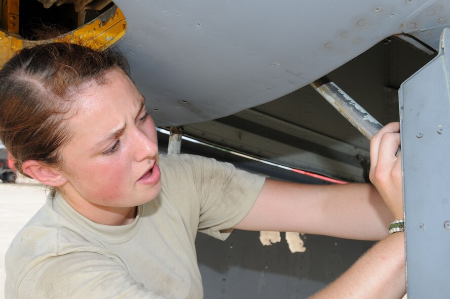 Senior Airman Jessica Haig, a 916th crew chief,  attaches nose door rods to a KC-135R during seasoning training at Seymour Johnson Air Force Base. (USAF photo by Staff Sgt. Terrica Y. Jones 916 ARW/PA)