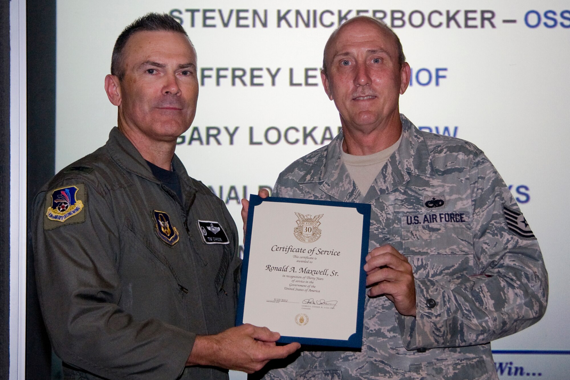 GRISSOM AIR RESERVE BASE, Ind. -- Tech. Sgt. Ronald A. Maxwell, Sr., 434th Maintenance Squadron structural repair specialist, receives his certificate of recognition for completing 30 years of federal civil service from Col. William T. "Tim" Cahoon during a civilian commander's call held here recently. Cahoon is the 434th ARW commander. (U.S. Air Force photo/Tech. Sgt. Mark R. W. Orders-Woempner)
