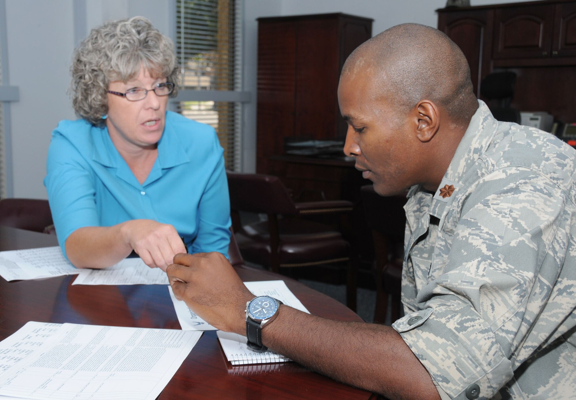 Deputy comptroller Joyce Sloan gives Maj. Phelemon Williams II a budget briefing June 24.  Williams, who took command of the 81st Comptroller Squadron June 23, is a recent graduate of the Army Command and General Staff College, Fort  Leavenworth, Kan.  (U.S. Air Force photo by Kemberly Groue)