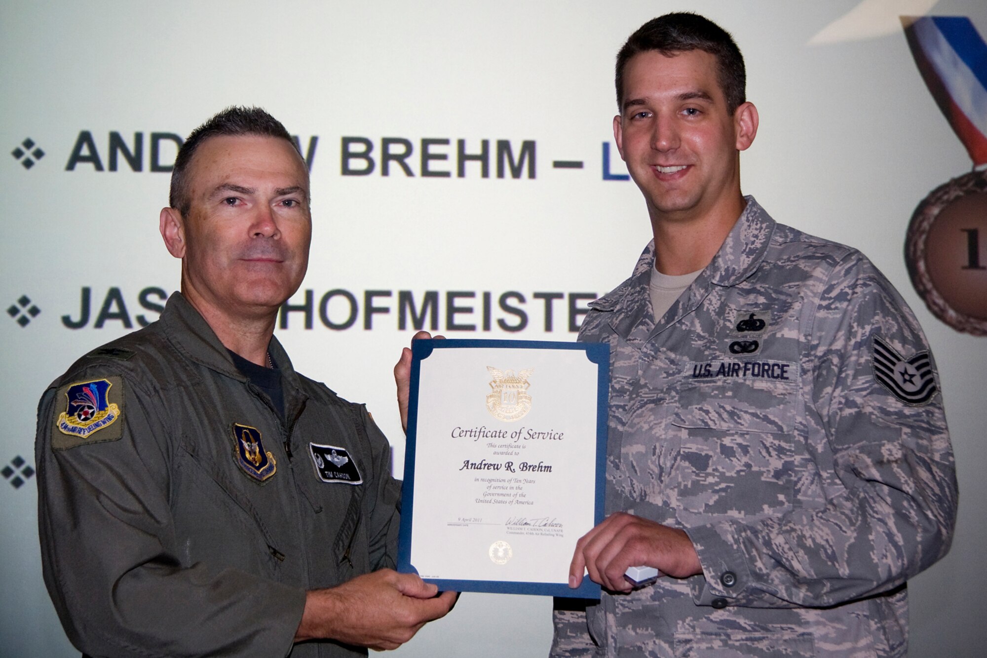 GRISSOM AIR RESERVE BASE, Ind. -- Tech. Sgt. Andrew Brehm, 434th Logistics Readiness Squadron inventory management specialist, receives his certificate of recognition for completing 10 years of federal civil service from Col. William T. "Tim" Cahoon during a civilian commander's call held here recently. Cahoon is the 434th ARW commander. (U.S. Air Force photo/Tech. Sgt. Mark R. W. Orders-Woempner)

