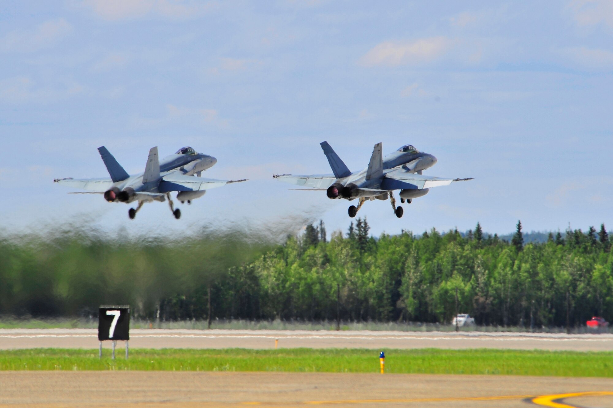 Two Royal Australian Air Force F/A-18 Super Hornets launch side-by-side from the runway during RED FLAG-Alaska 11-2 July 11, 2011, Eielson Air Force Base, Alaska. RF-A, a two week long exercise, focuses on aerial combat training for U.S. and allied forces and is conducted within the Joint Pacific Alaska Range Complex, a 67,000 square mile training range. (U.S. Air Force photo/Staff Sgt. Christopher Boitz)