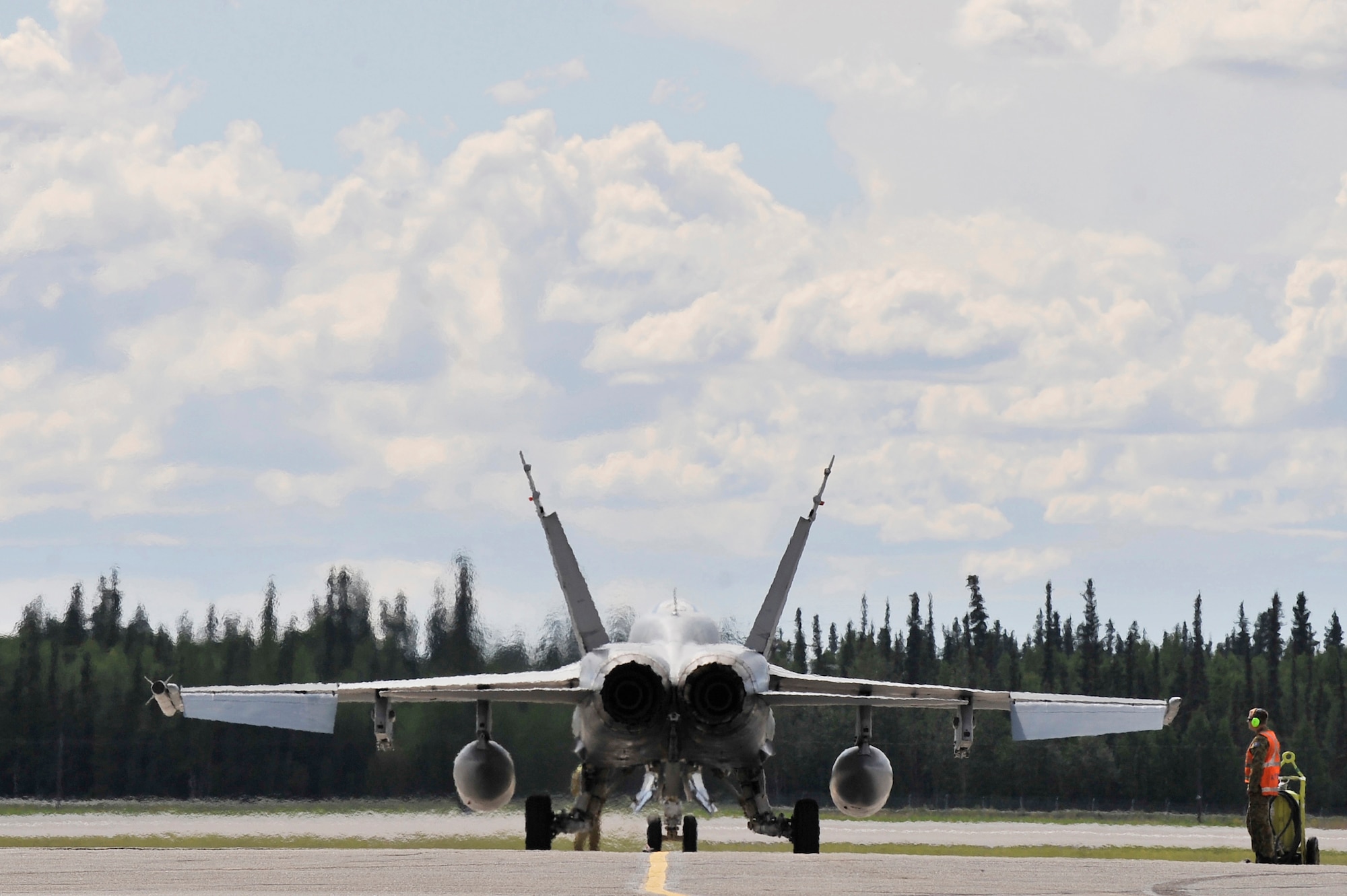 Visible heat waves from a Royal Australian Air Force F/A-18 Super Hornet pour from the engines prior to launching July 6, 2011, Eielson Air Force Base, Alaska. The RAAF is participating in RED FLAG-Alaska 11-2, a two week long exercise designed to give pilots aerial combat training. (U.S. Air Force photo/Staff Sgt. Christopher Boitz)