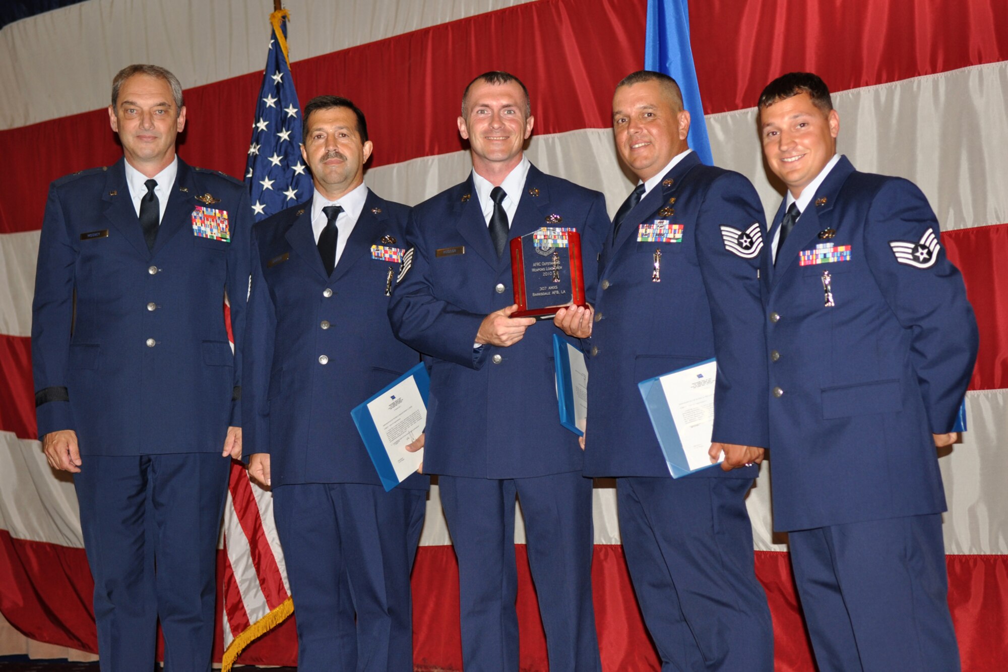 Brig. Gen. John J. Mooney III, the commander of the 307th Bomb Wing, poses with Technical Sgts Robert Carter, James Hudson, Jesus Rodriguez and Staff Sgt. Justin Castille, during the Barksdale Reserve Awards Ceremony at Hoban Hall on Barksdale Air Force Base, La., July 10, 2011. All four of the sergeants are assigned to the 307th Aircraft Maintenance Squadron and won the Outstanding Weapons Load Crew Award for 2010 for the Air Force Reserve Command. (U.S. Air Force photo/Staff Sgt. Ted Daigle)