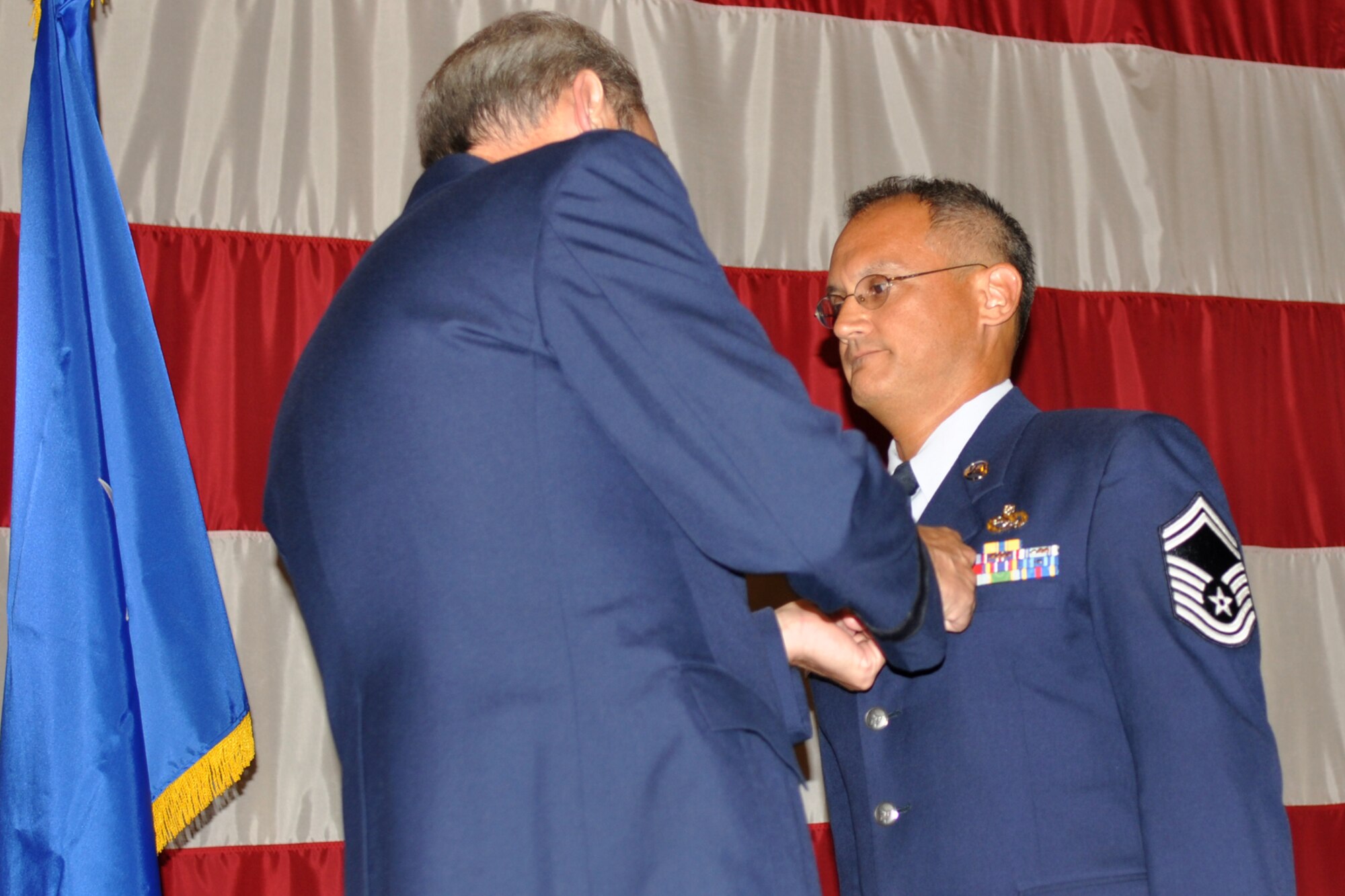 Brig. Gen. John J. Mooney III, the commander of the 307th Bomb Wing, pins the Air Force Achievement Medal on Senior Master Sgt. Stephen G. Robicheaux, the quality assurance superintendent for the 307th Maintenance Group, during the Barksdale Reserve Awards Ceremony at Hoban Hall on Barksdale Air Force Base, La., July 10, 2011. Sergeant Robicheaux received the medal for outstanding achievement as Quality Assurance Chief Inspector from Oct. 13, 2010 to Feb. 15, 2011, while assigned to the 386th Expeditionary Maintenance Group. (U.S. Air Force photo/Staff Sgt. Ted Daigle)

