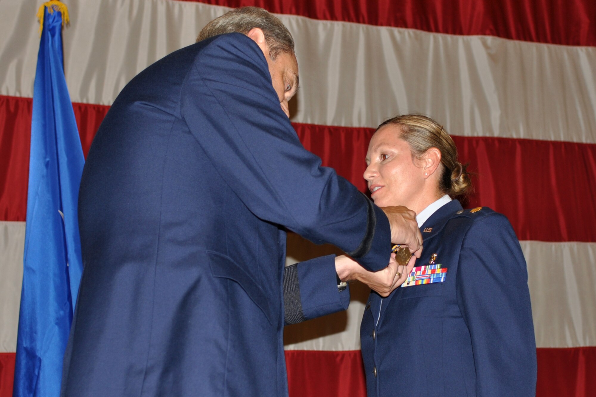 Brig. Gen. John J. Mooney III, the commander of the 307th Bomb Wing, pins the Air Force Commendation Medal on Major Susan G. Geer, the chief nurse for the 307th Medical Squadron, during the Barksdale Reserve Awards Ceremony at Hoban Hall on Barksdale Air Force Base, La., July 10, 2011. Major Geer received the medal for meritorious service to 917th Medical Squadron from Nov. 28, 2003 to April 30, 2009. (U.S. Air Force photo/Staff Sgt. Ted Daigle) 