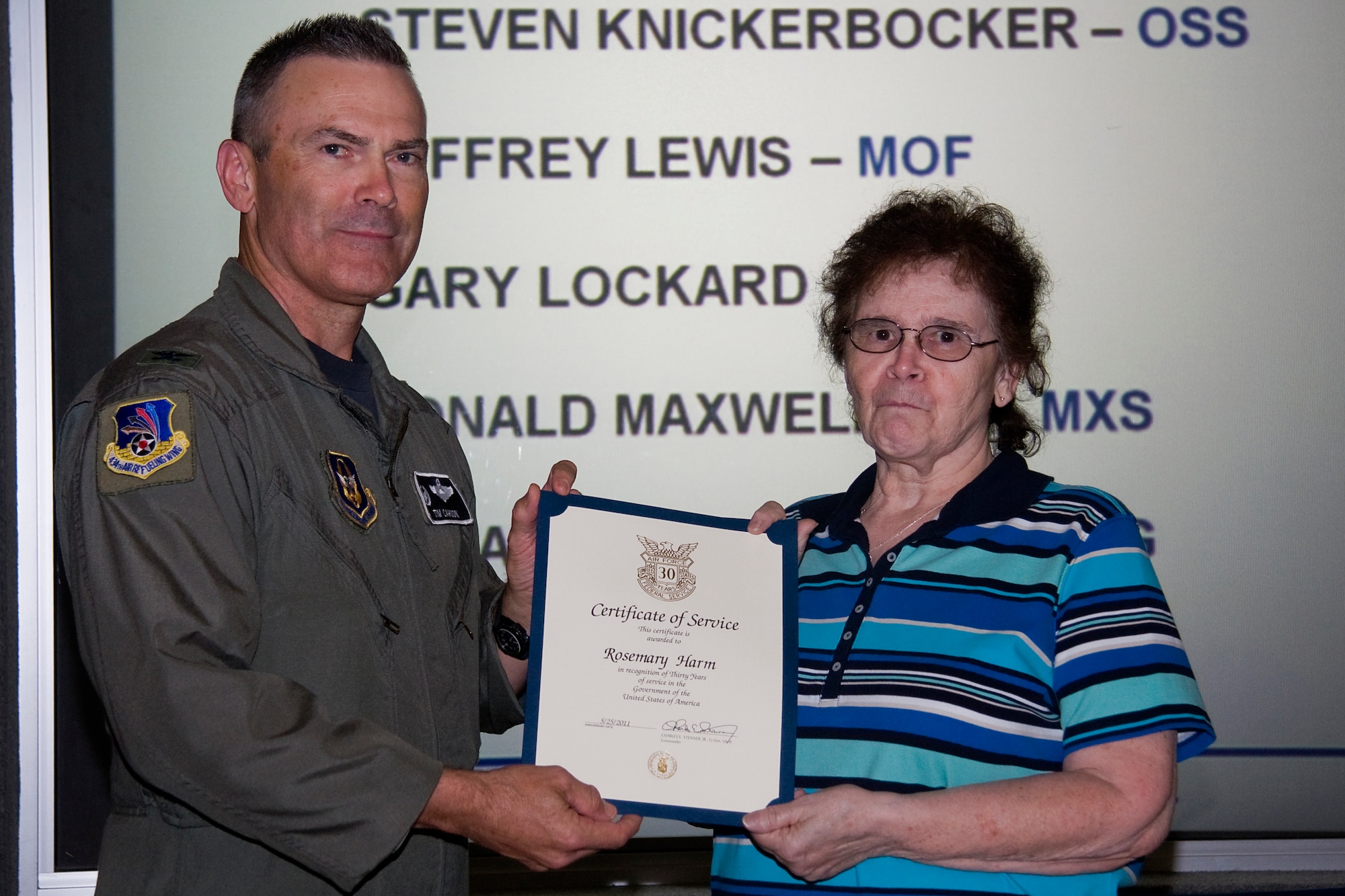 GRISSOM AIR RESERVE BASE, Ind. -- Rosemary Harm, 434th Force Support Squadron assistant customer service chief, receives her certificate of recognition for completing 30 years of federal civil service from Col. William T. "Tim" Cahoon, 434th Air Refueling Wing commander. Harm, along with several other Grissom civil service employees were recognized during a civilian commander's call held here recently. (U.S. Air Force photo/Tech. Sgt. Mark R. W. Orders-Woempner)
