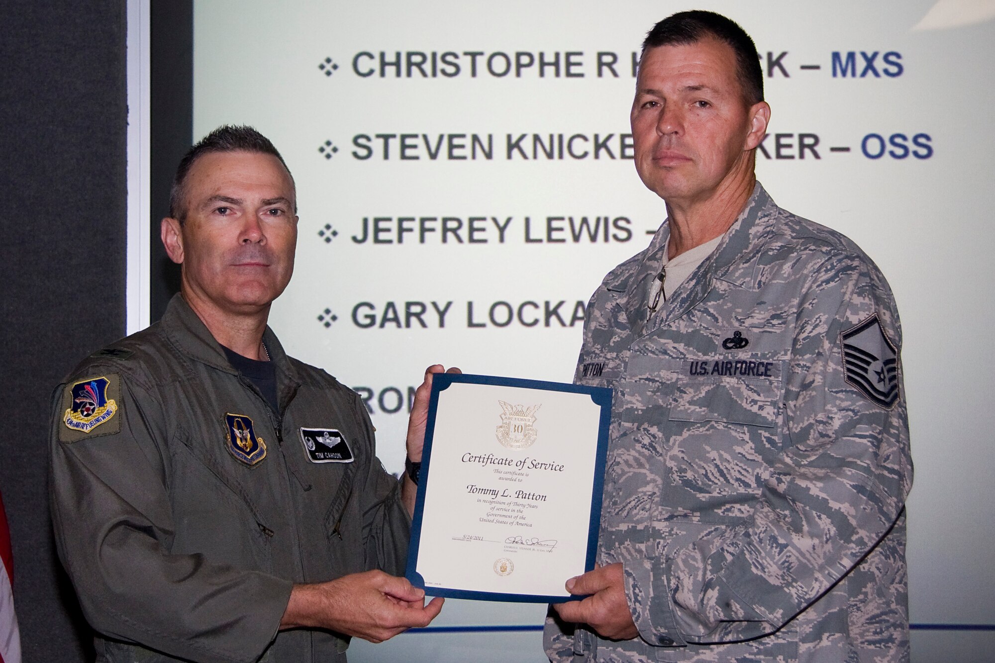 GRISSOM AIR RESERVE BASE, Ind. -- Master Sgt. Tommy Patton, 434th Aircraft Maintenance Squadron sortie support specialist, receives his certificate of recognition for completing 30 years of federal civil service from Col. William T. "Tim" Cahoon, 434th Air Refueling Wing commander. Patton, along with several other Grissom civil service employees were recognized during a civilian commander's call held here recently. (U.S. Air Force photo/Tech. Sgt. Mark R. W. Orders-Woempner)
