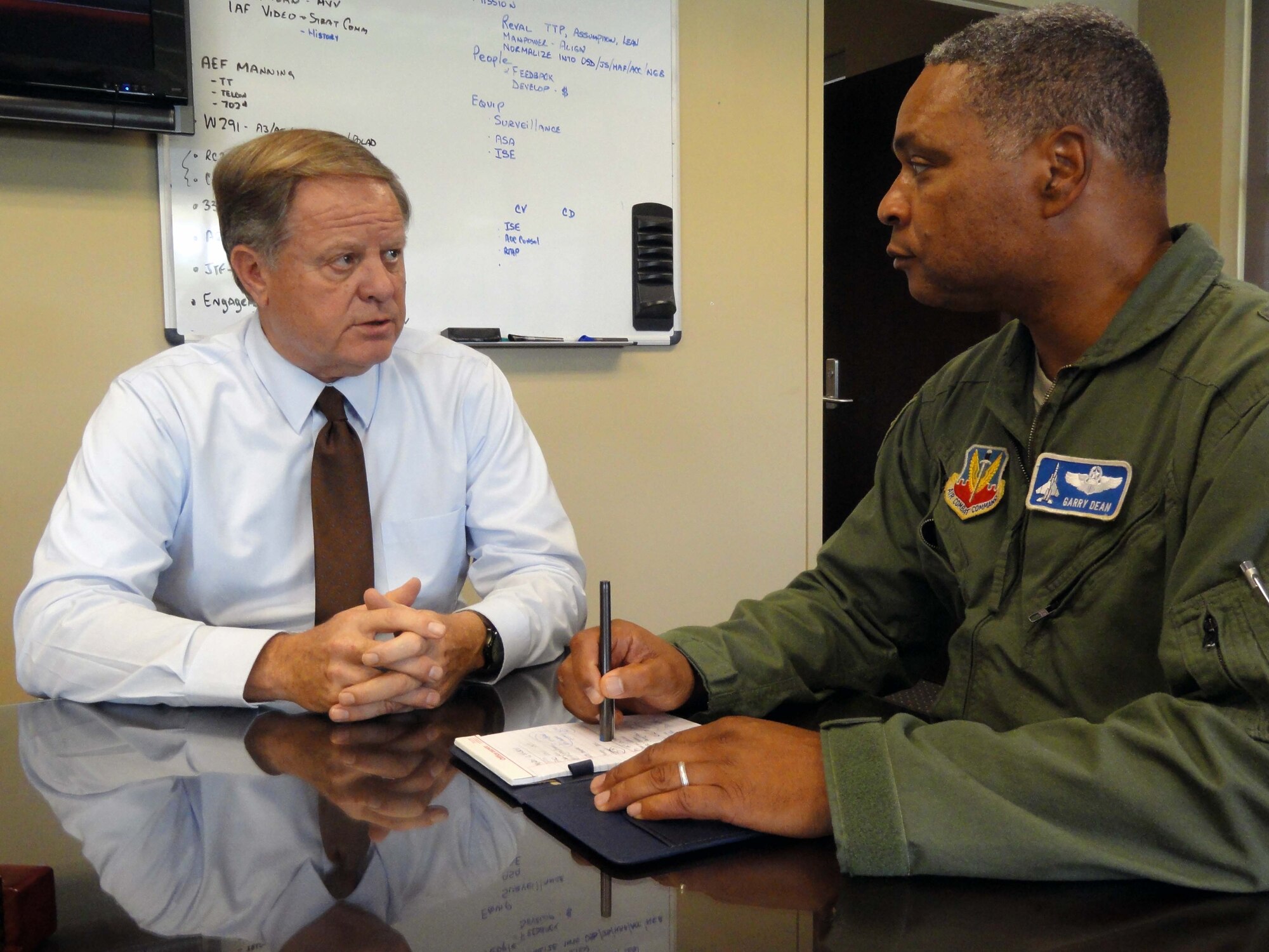 Gary Larson, left, political advisor for Air Forces Northern, meets with Maj. Gen. Garry C. Dean, AFNORTH commander, to advise him on issues pertaining to the command’s partnership with Mexico. The POLAD position at AFNORTH was created in 2010 when the Departments of Defense and State recognized how crucial foreign affairs were to the command. (U.S. Air Force photo by Angela Pope)