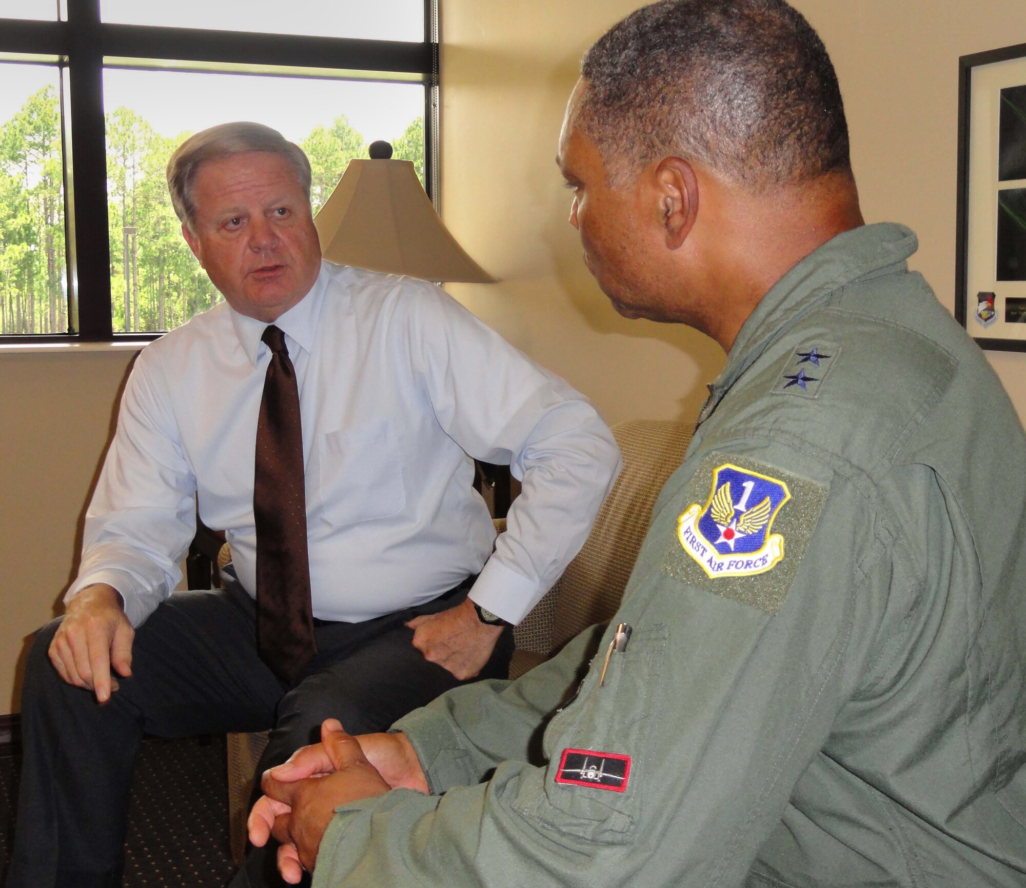 Gary Larson, left, political advisor for Air Forces Northern, discusses foreign policy issues with Maj. Gen. Garry C. Dean, AFNORTH commander. Larson was chosen to serve as the first POLAD at AFNORTH after the Departments of Defense and State realized how large the command’s international mission had become. (U.S. Air Force photo by Angela Pope)