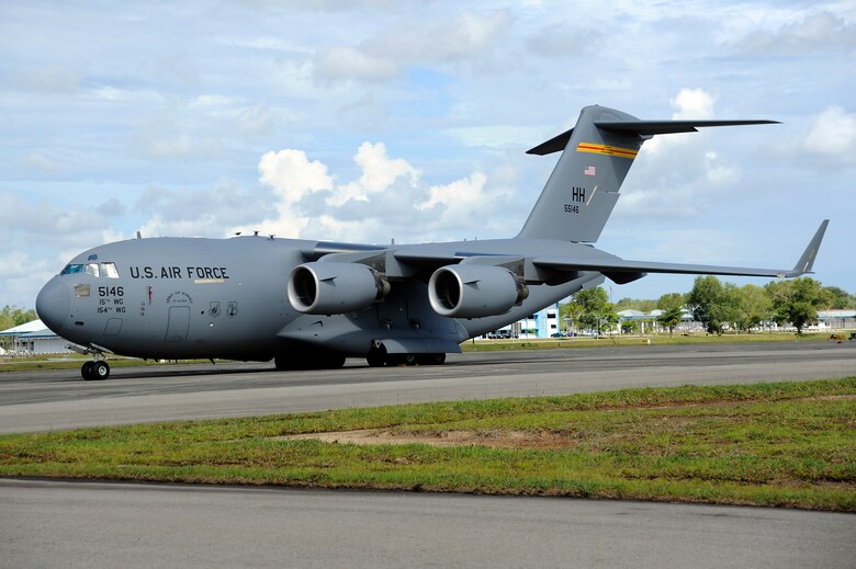 Brunei Darussalam -- A C-17 Globemaster III from Joint Base Pearl Harbor Hickam, Hawaii sits on the flightline at Rimba Air Base, Brunei, July 3 after their arrival for participation in the 3rd Biennial Brunei Darussalam International Defense Exhibition. This year coincides with the 50th anniversary of the Royal Brunei Armed Forces and is forecasted to host more than 160 exhibitors and 150 international delegates. (U.S. Air Force photo/Staff Sgt. Marie Brown/Released)
