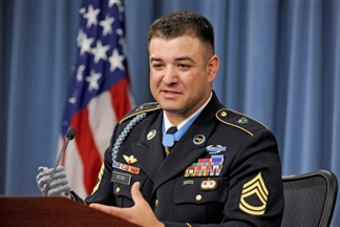 Medal of Honor recipient Army Sgt. 1st Class Leroy Petry describes to reporters the combat action which occurred near Paktya, Afghanistan, on May 26, 2008, resulting in his nomination to receive the nation's highest award for valor in the Pentagon on July 13, 2011.  