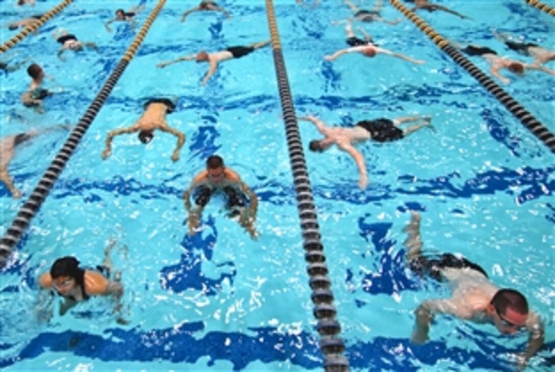 Navy freshmen receive basic swimming and diving instruction at Lejeune Hall at the U.S. Naval Academy in Annapolis, Md., July 13, 2011. The new midshipmen are participating in Plebe Summer, six-weeks of training intended to transition the students from civilian to military life.