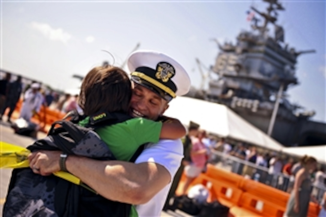 U.S. Navy  Lt. Lief Walroth greets his son during a homecoming celebration for members of Helicopter Anti-submarine Squadron 11 during a port visit by the aircraft carrier USS Enterprise to Mayport, Fla., July 13, 2011. The Enterprise and Carrier Air Wing 1 are returning to homeport at Naval Station Norfolk after completing a six-month deployment to the U.S. 5th and 6th Fleet areas of responsibility. 