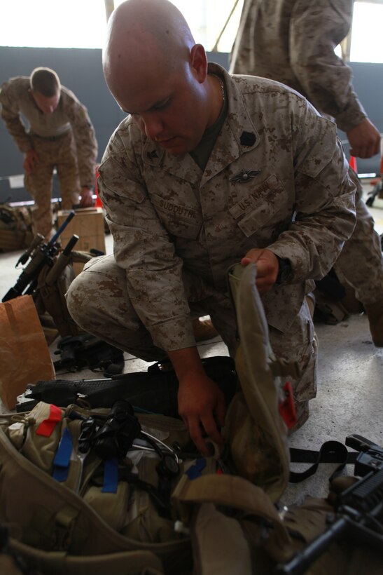 Marines with Combat Assault Battalion, 3rd Marine Division, III Marine Expeditionary Force, work to take down a tent at Landing Zone Cardinal July 15 after participating in a four-day training evolution.