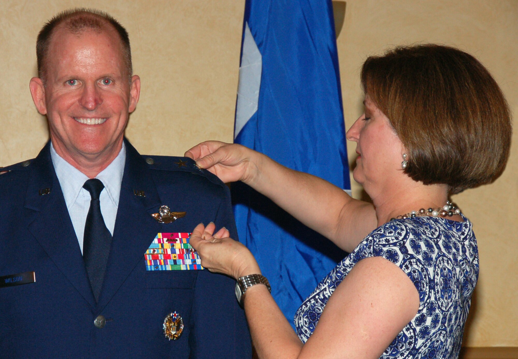 BARKSDALE AIR FORCE BASE, La. - Nancy Wilson pins the second star on Maj. Gen. Stephen Wilson, Eighth Air Force commander, during his promotion ceremony at the Barksdale Club July 15. General Wilson was frocked to the rank of major general. Frocking is a term for a commissioned officer selected for promotion which allows them to wear the insignia of the higher grade before the official date of promotion. (U.S. Air Force photo by Staff Sgt. Brian Stives)