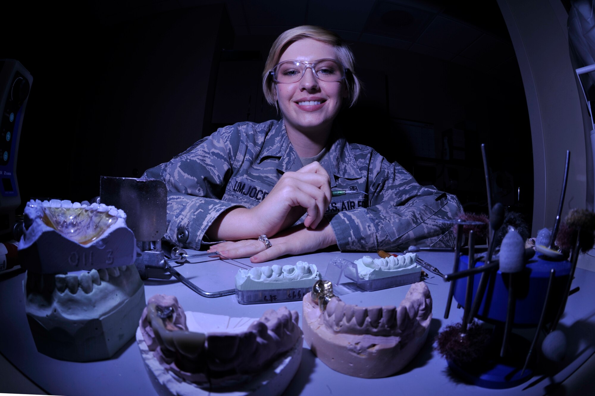 VANDENBERG AIR FORCE BASE, Calif. -- Posing for a photo, Staff Sgt. Nora Limjoco, a 30th Medical Operations Squadron dental lab technician, smiles during a photo shoot at the dental clinic here Thursday, July 14, 2011.  Sergeant Limjoco earned the Air Force Airman of the Year award.  (U.S. Air Force photo/Staff Sgt. Andrew Satran) 
