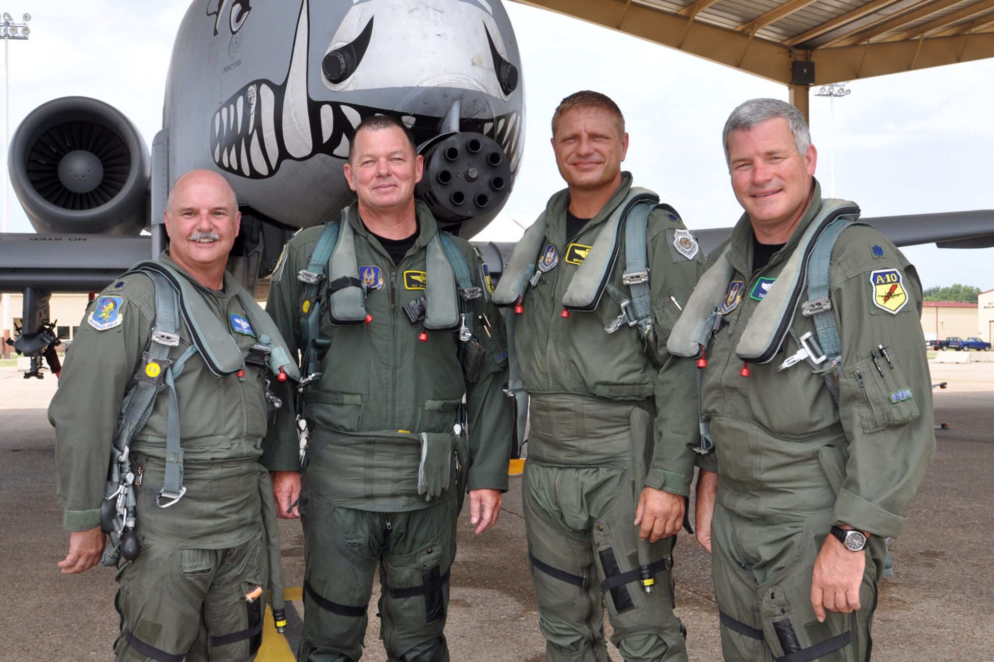 (L to R) Lt. Cols David Deaton, James Macaulay, Brady Glick and Marc Olson, pose for the “hero shot” after participating in a four-ship flight at Barksdale Air Force Base, La., July 15, 2011. During their flight, they surpassed the 20,000 combined hours mark—a feat never before accomplished by four pilots in the A-10. The four Barksdale-based Air Force Reserve fighter pilots are assigned to the 47th Fighter Squadron. (U.S. Air Force photo/Tech. Sgt. Jeff Walston)