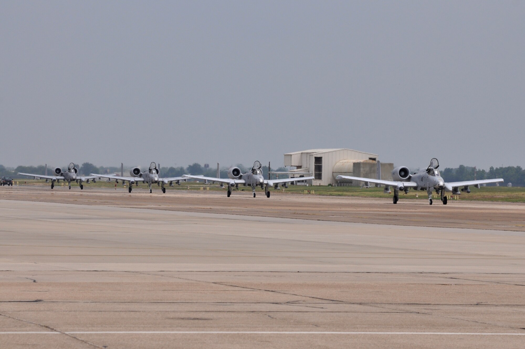 Lt. Cols James Macaulay, David Deaton, Marc Olson and Brady Glick, taxi their A-10 Thunderbolt II jet aircraft back to their parking spots after participating in a four-ship flight at Barksdale Air Force Base, La., July 15, 2011. During their flight, they surpassed the 20,000 combined hours mark—a feat never before accomplished by four pilots in the A-10. The four Barksdale-based Air Force Reserve fighter pilots are assigned to the 47th Fighter Squadron. (U.S. Air Force photo/Tech. Sgt. Jeff Walston)