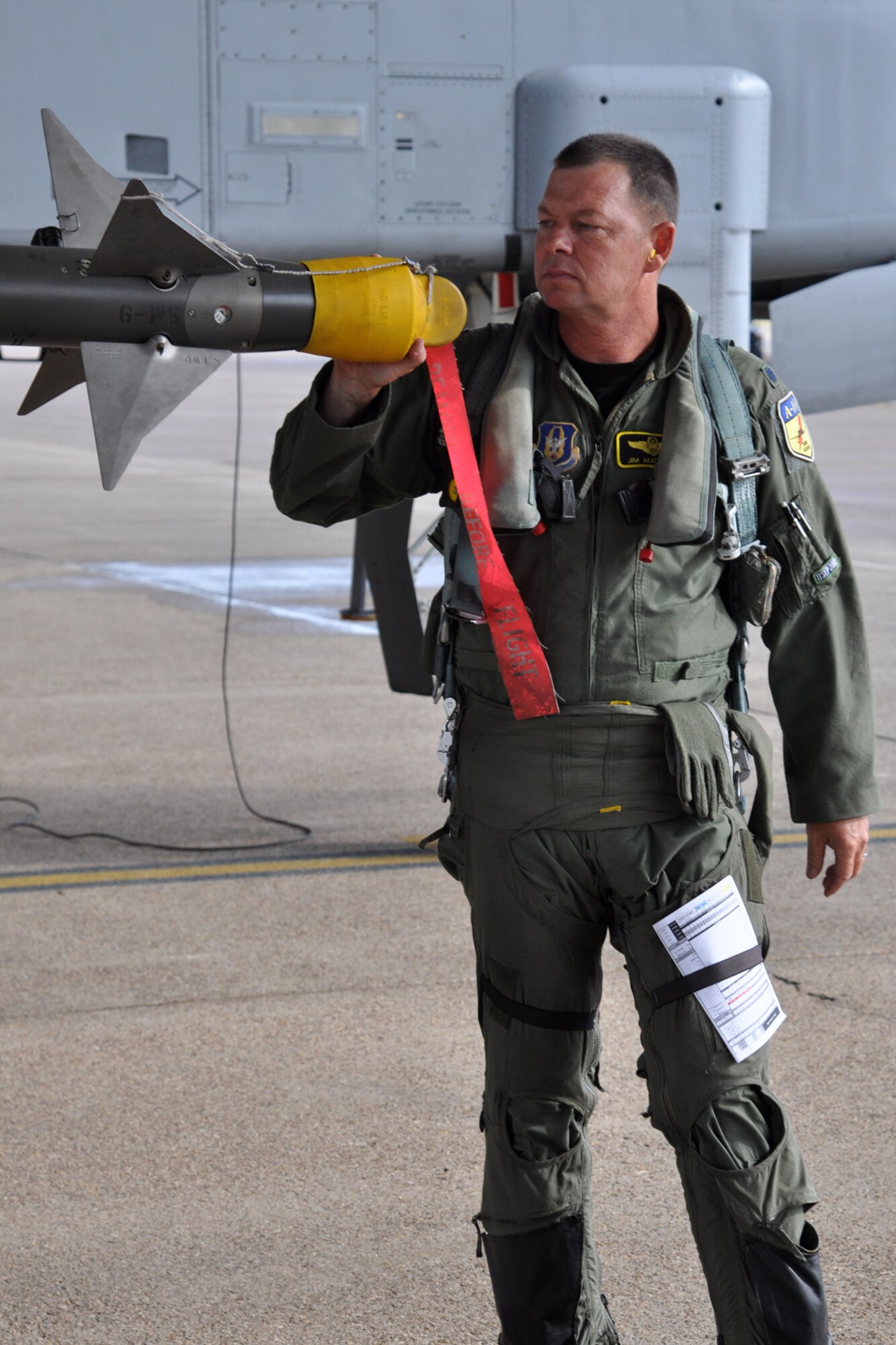 Lt. Col. James Macaulay, the deputy commander for the 917th Fighter Group, performs a pre-flight check before taking off to participate in a four-ship flight at Barksdale Air Force Base, La., July 15, 2011. Colonel Macaulay participated in a four-ship flight, during which the pilots surpassed the 20,000 combined hours mark—a feat never before accomplished by four pilots in the A-10. (U.S. Air Force photo/Tech. Sgt. Jeff Walston) 