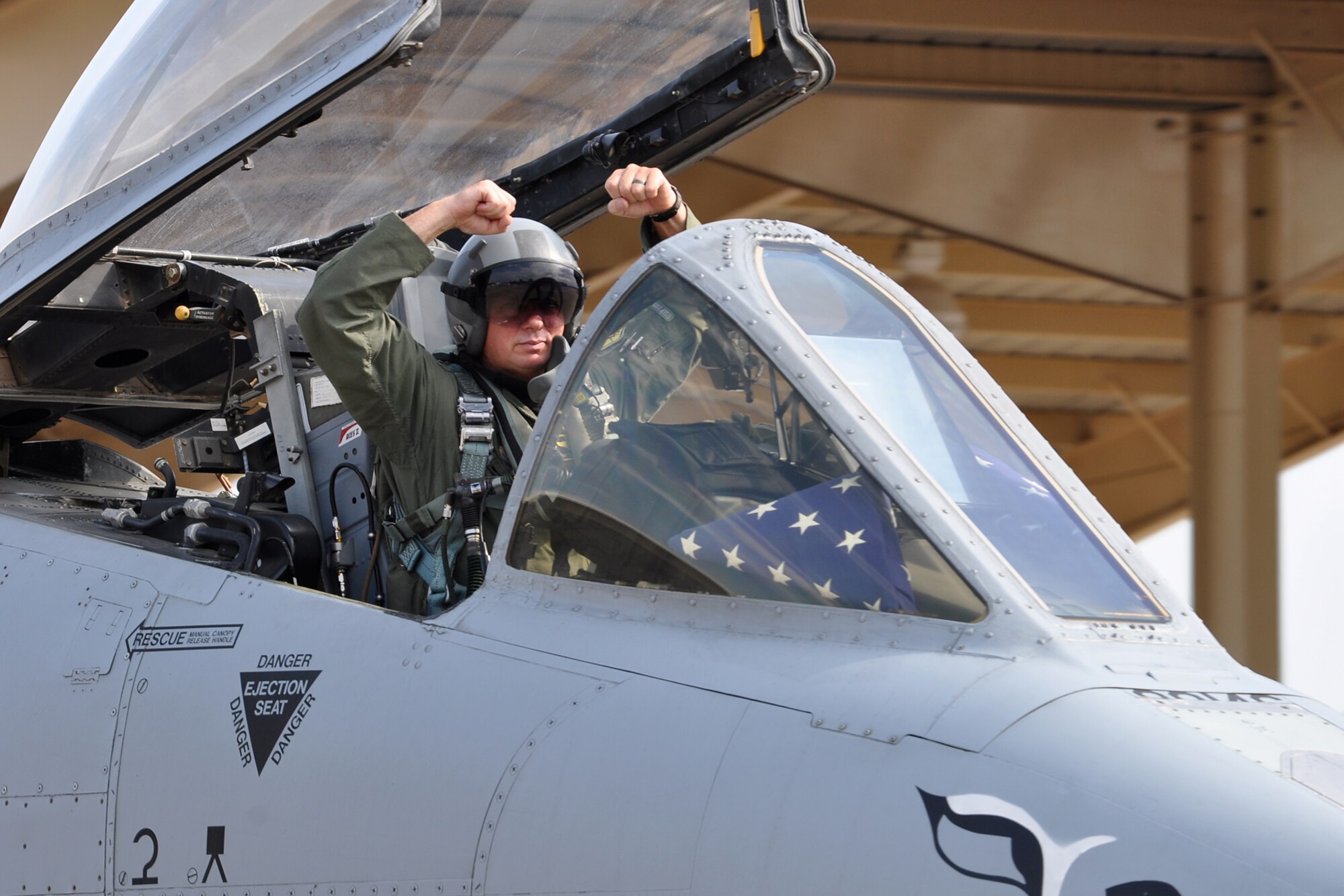 Lt. Col. James Macaulay, the deputy commander for the 917th Fighter Group, strikes a pose before taking off for a flight in an A-10 Thunderbolt II fighter jet at Barksdale Air Force Base, La., July 15, 2011. Colonel Macaulay participated in a four-ship flight, during which the pilots surpassed the 20,000 combined hours mark—a feat never before accomplished by four pilots in the A-10. (U.S. Air Force photo/Tech. Sgt. Jeff Walston) 
