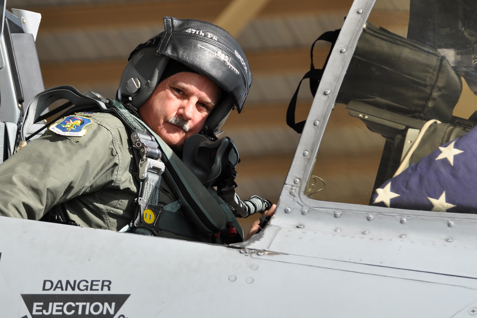 Lt. Col. David Deaton, a pilot assigned to the 47th Fighter Squadron, prepares his equipment for a flight in an A-10 Thunderbolt II fighter jet at Barksdale Air Force Base, La., July 15, 2011. Colonel Deaton participated in a four-ship flight, during which the pilots surpassed the 20,000 combined hours mark—a feat never before accomplished by four pilots in the A-10. (U.S. Air Force photo/Tech. Sgt. Jeff Walston) 