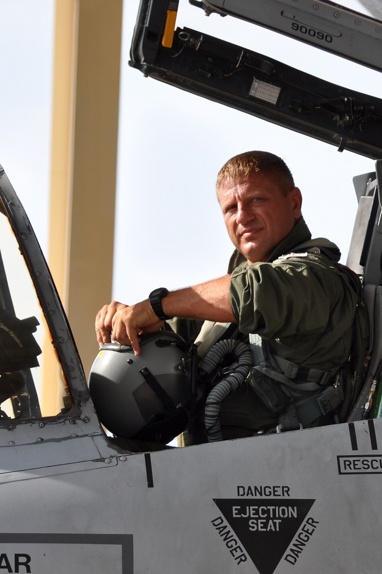 Lt. Col. Brady Glick, a pilot assigned to the 47th Fighter Squadron, prepares his equipment for a flight in an A-10 Thunderbolt II fighter jet at Barksdale Air Force Base, La., July 15, 2011. Colonel Glick participated in a four-ship flight, during which the pilots surpassed the 20,000 combined hours mark—a feat never before accomplished by four pilots in the A-10. (U.S. Air Force photo/Tech. Sgt. Jeff Walston) 

