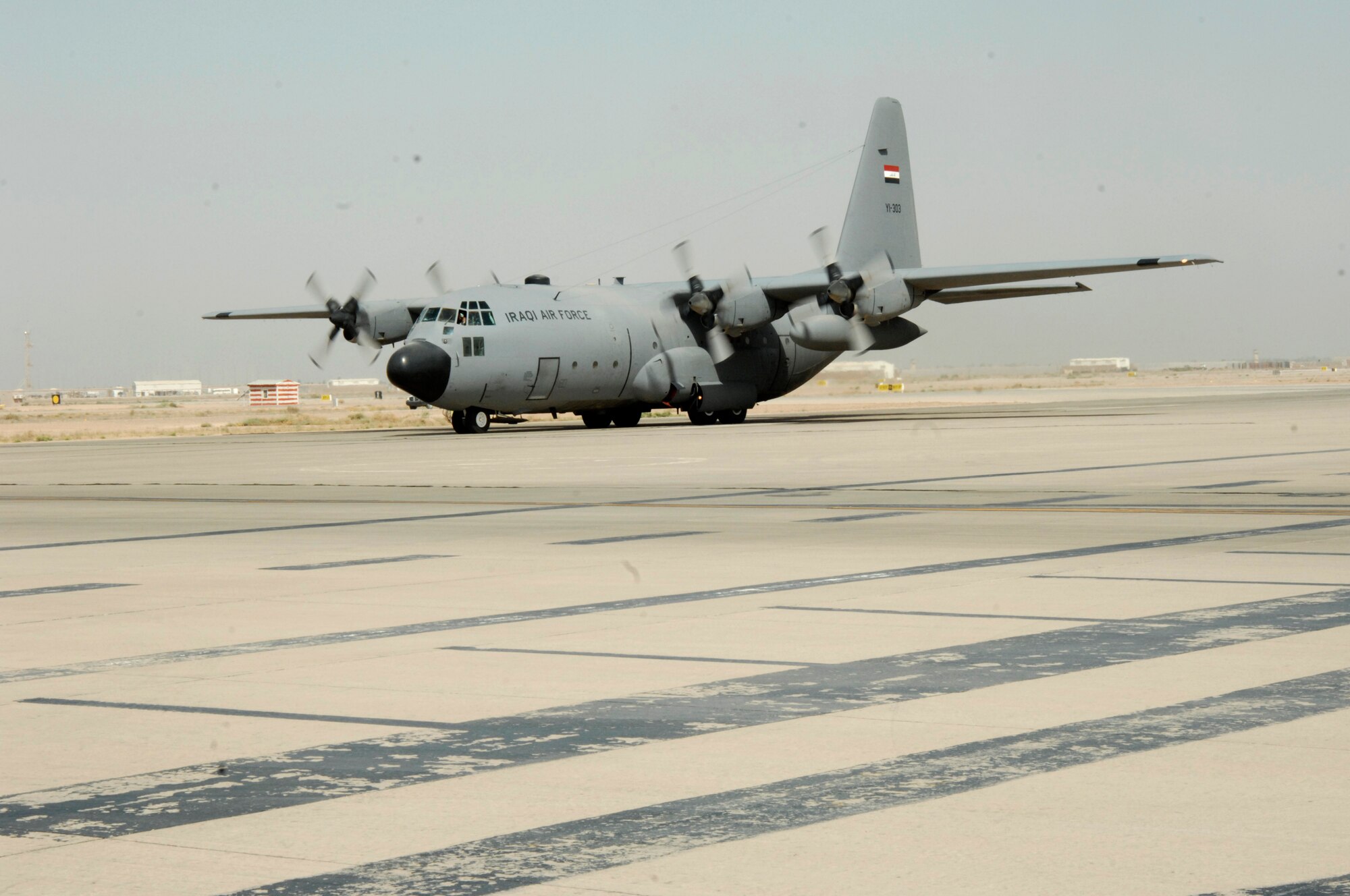An Iraqi air force C-130 aircraft taxis after landing at Joint Base Balad, Iraq, July 6, 2011, to bring passengers to the first Iraqi air force logistics wing commander summit. Passengers included logistics wing commanders from across Iraq, Iraqi Training and Advisory Mission-Air staff advisors and IqAF logistics staff members including the Iraqi director of logistics. (U.S. Air Force photo/Senior Airman Amber R. Kelly-Herard