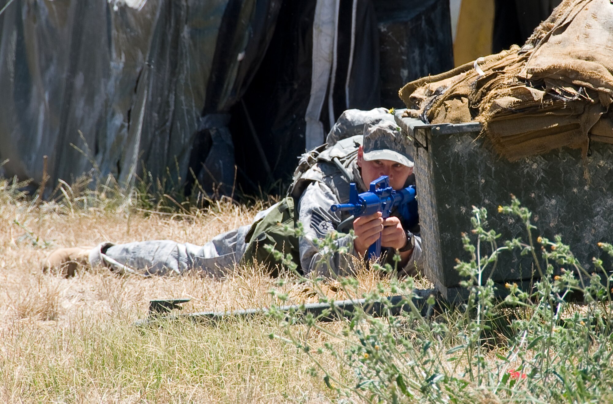 Staff Sgt. Jason Bell, 60th Security Forces Squadron 2011 Rodeo team members finds available cover on the obstacle course during combat weapons training. (U.S. Air Force photo/Heide Couch)