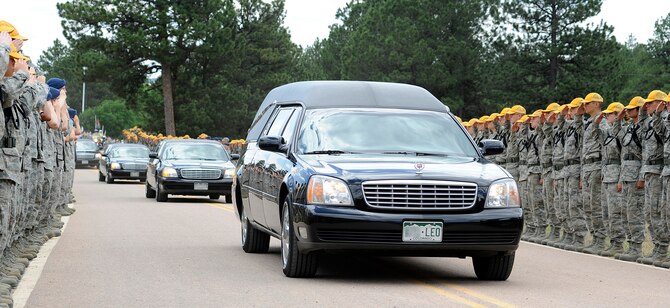 Basic cadets and cadre members render final honors to Col. Leo Boston, who was missing in action from 1966 to 2011, during a funeral service for Boston at the Air Force Academy July 15, 2011. Boston, a native of Cañon City, Colo., went missing near the Black River in North Vietnam's Son La Province during a mission in an A-1E Skyraider. (U.S. Air Force photo/Mike Kaplan)