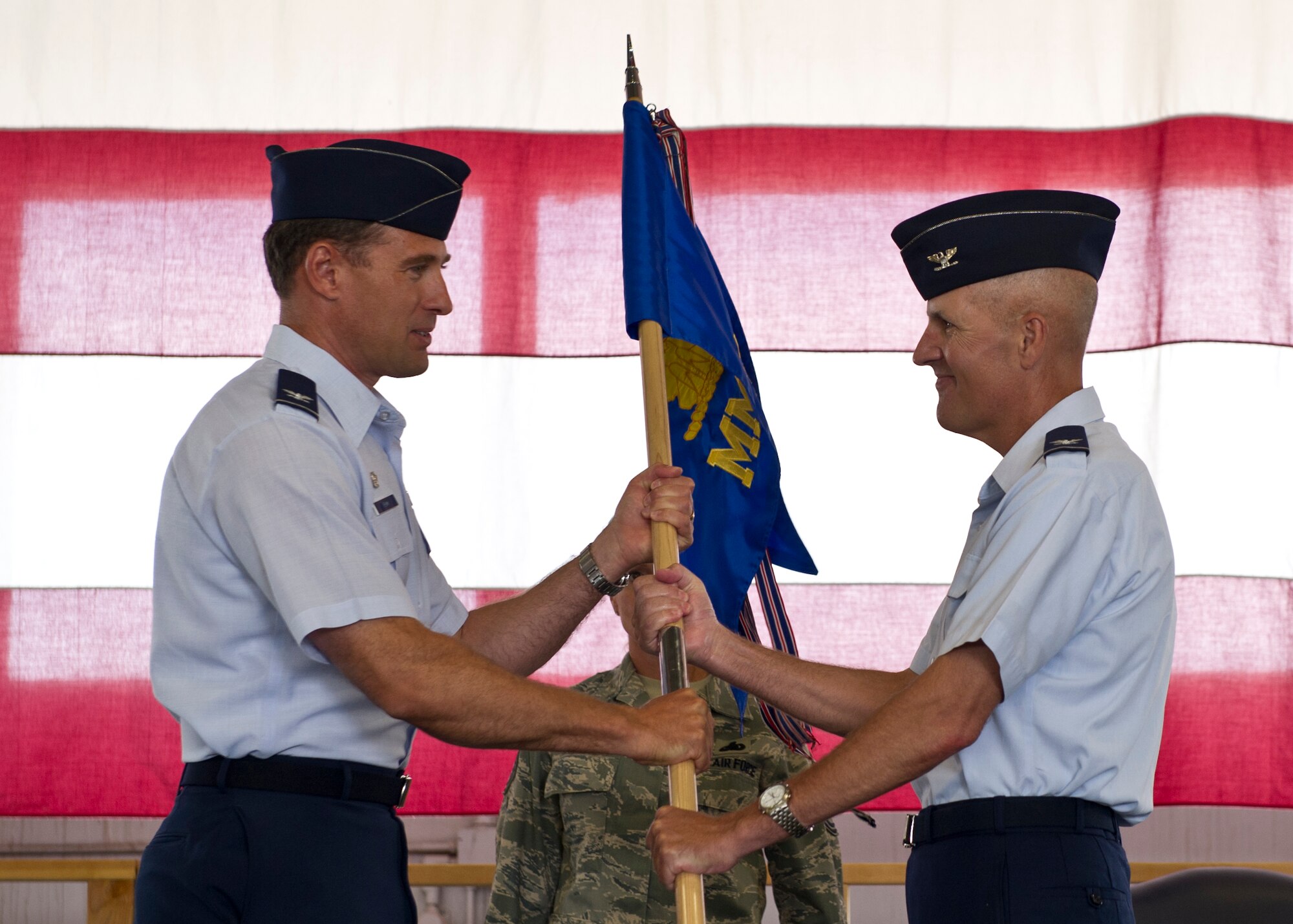 HOLLOMAN AIR FORCE BASE, N.M. -- Col. James Krajewski accepts the guideon from Col. David Krumm, 49th Wing commander, July 14, 2011, and assumes command of the 49th Materiel Maintenance Group. Prior to becoming the 49th MMG commander, Colonel Krajewski was the director of logistics and the assistant chief of staff, logistics, Air Component Command at Osan Air Base, Republic of Korea. (U.S. Air Force photo by Airman 1st Class Joshua Turner/Released)