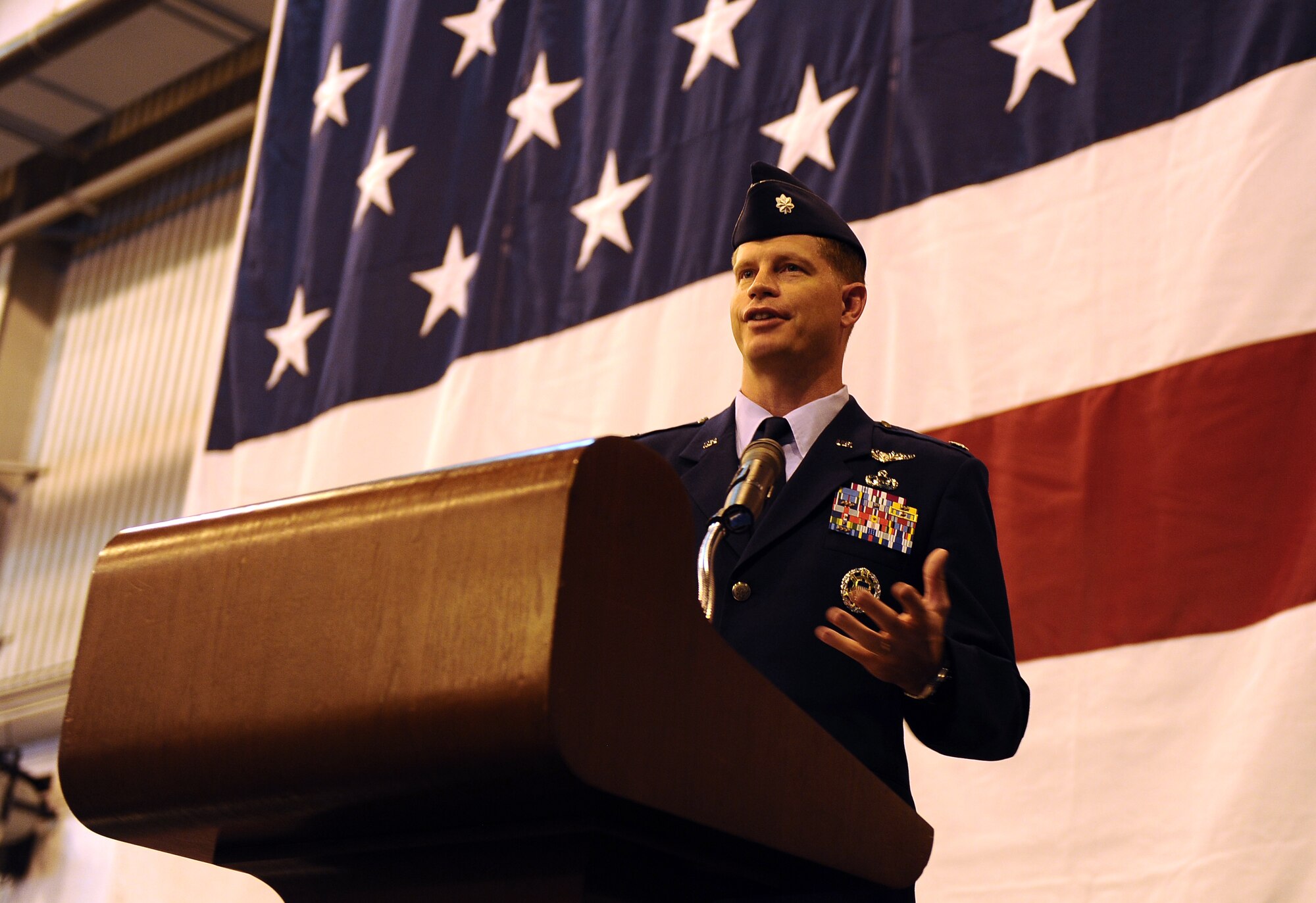 Air Force Lt. Col. Jeffrey P. Ford, incoming 97th Intelligence Squadron commander, greets his new troops after assuming command at a formal change-of-command ceremony held in Dock 1 of the Bennie Davis Maintenance Facility, on Offutt Air Force Base, Neb., July 15.   (U.S. Air Force photo by Josh Plueger/Released)