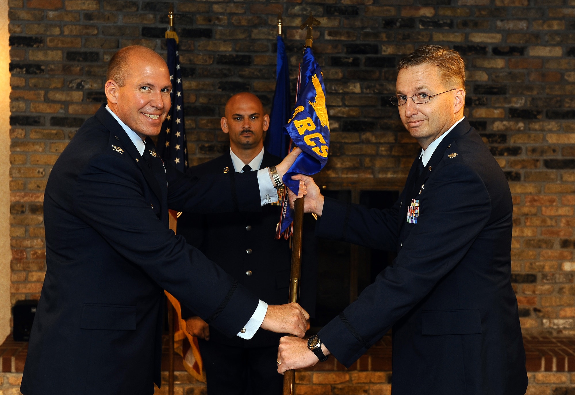 Air Force Lt. Col. Stephen A. Polomsky, (right), assumes command of the 343d Recruiting Squadron during a change-of-command ceremony held at the Community Center on Offutt Air Force Base, Neb., July 14. Col. Michael E. Vlk, commander of the 372d Recruiting Group, presided over the ceremony welcoming Polomsky to the Wolfpack.  (U.S. Air Force Photo by Josh Plueger/ Released)
