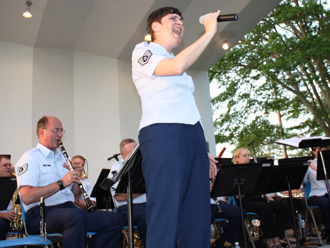 Salem, MA:  SSgt Ruth Petkaitis entertains an outdoor audience in Salem, MA, with Billy Joel's "New York State of Mind."  The ANG Band of the Northeast wrapped up an eight performance summer tour at Willow Park, in Salem, Massachusetts on July 7.