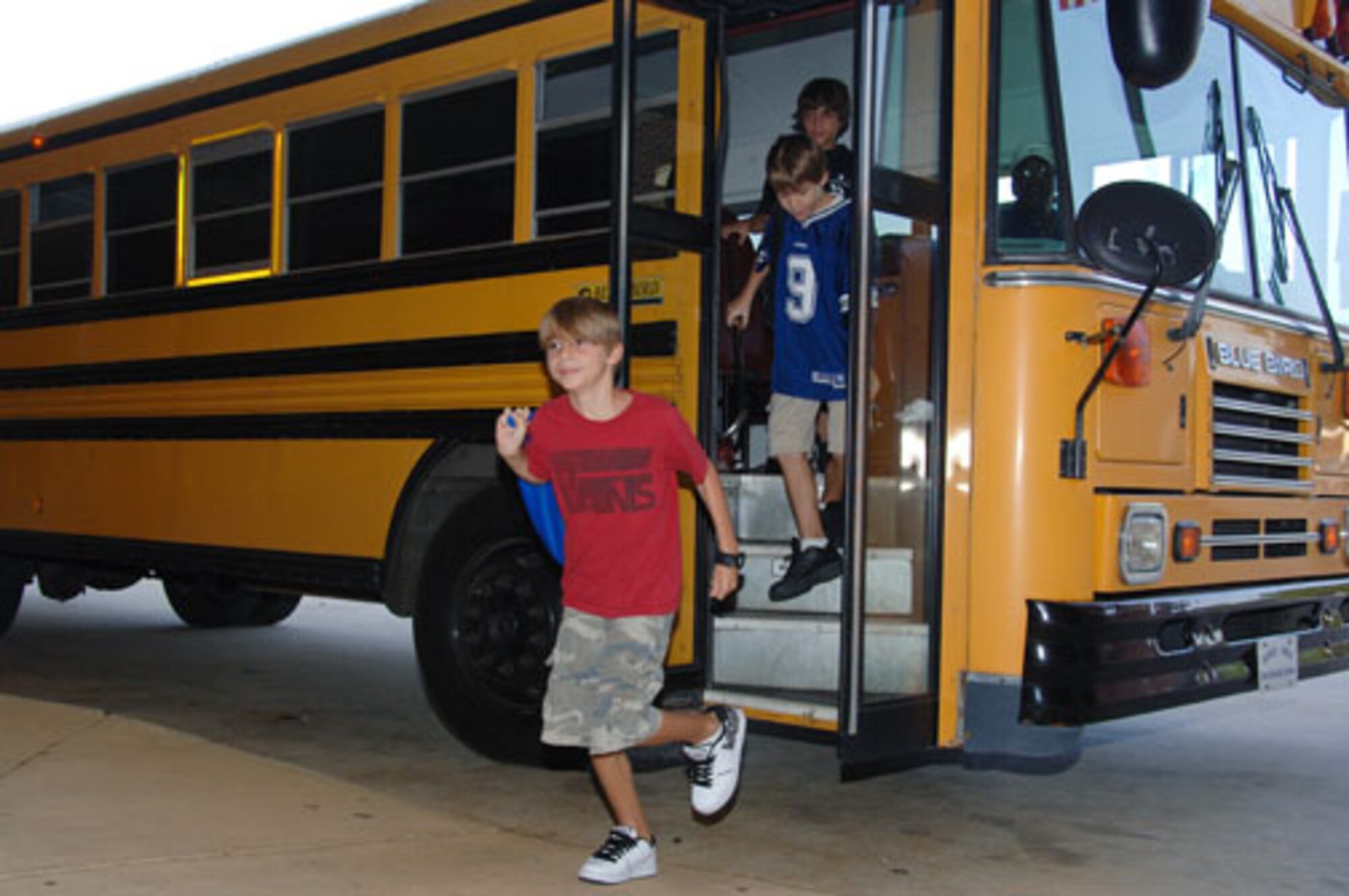 Tristan Bass, Cameron Griggs and Joel Maldonado disembark at Maxwell AFB Elementary School. (Air Force photo/Melanie Rodgers Cox)