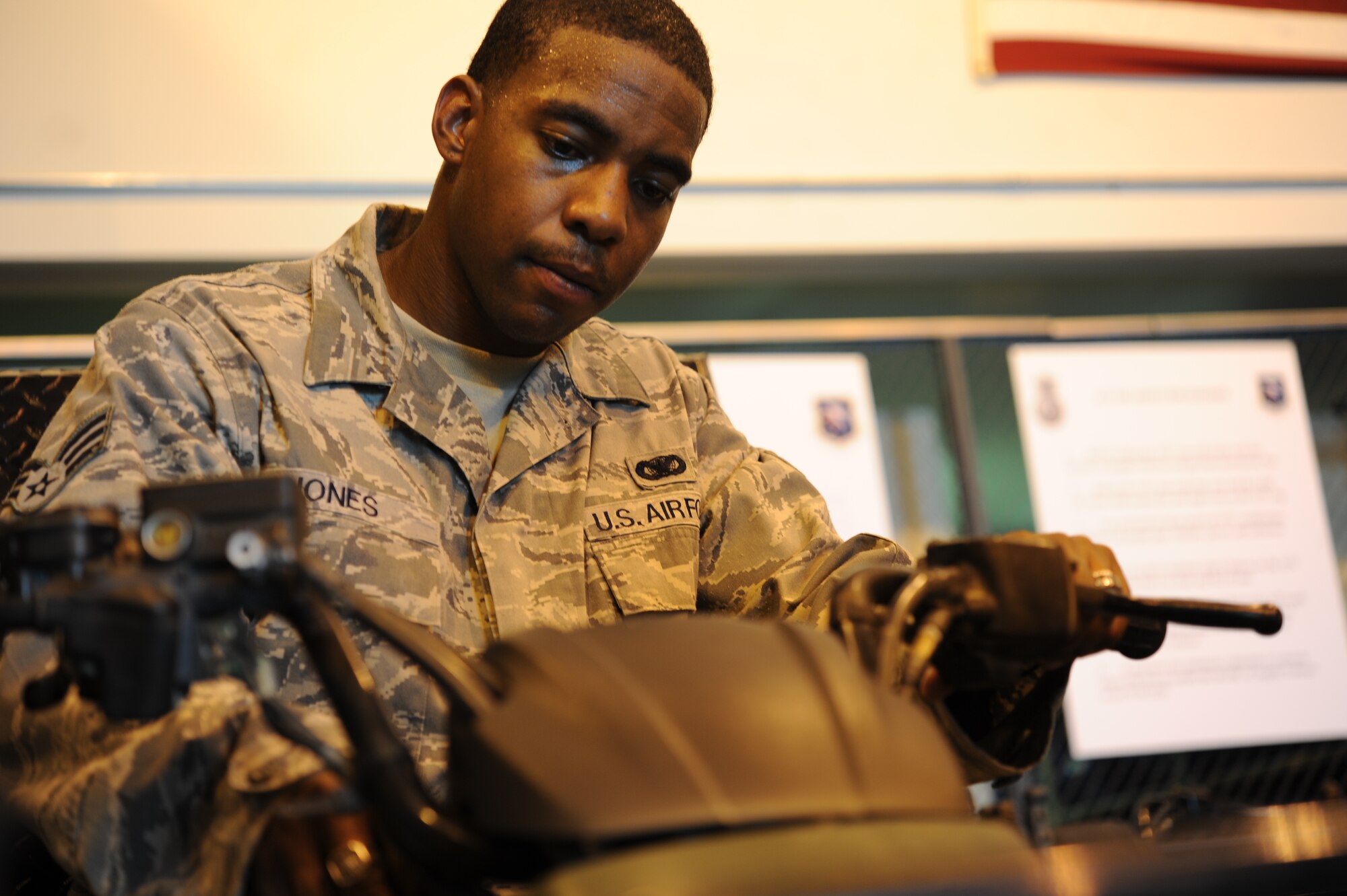 Senior Airman Chris Jones, 14th Security Forces Squadron NCOIC of Supply and Alternate Unit Deployment Manager, test runs an ATV at the 14th Security Forces Warehouse on July 13. (U.S. Air Force photo/Airman 1st Class Chase Hedrick)
