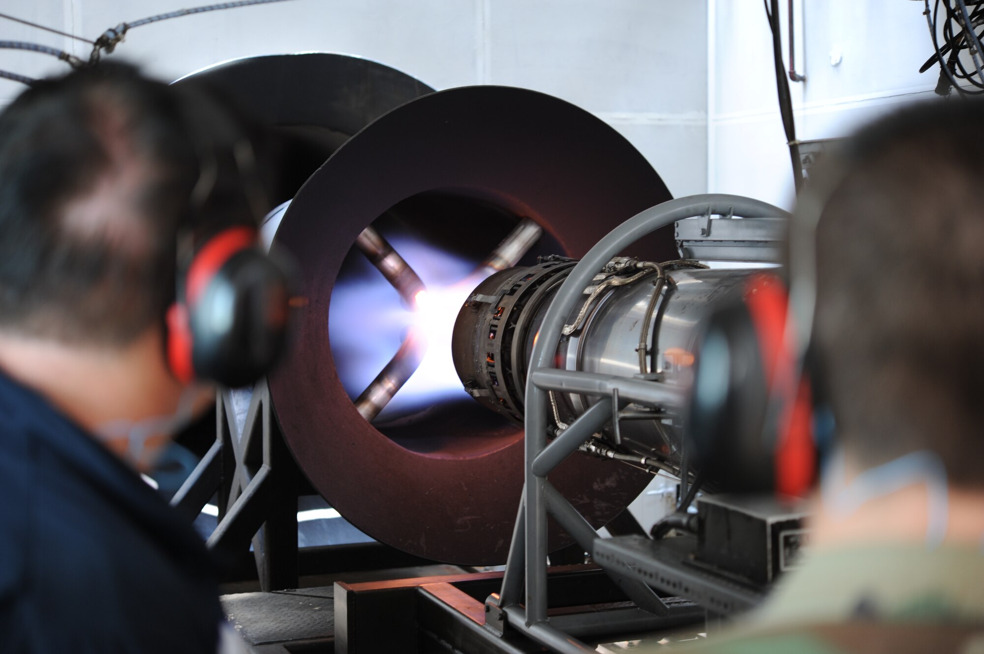 A T-38 Talon engine on afterburner runs inside the engine testing cell at Columbus Air Force Base on July 13. Forty Civil Air Patrol Cadets were given the opportunity to see this and many other aspects of what goes into being a Specialized Undergraduate Pilot Training student at Columbus AFB. (U.S. Air Force photo/Airman 1st Class Chase Hedrick)