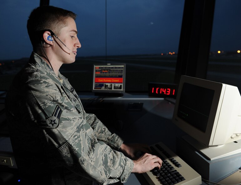 Airman 1st Class Joshua Neal, 22nd Operations Support Squadron air traffic controller, amends a flight plan July 7, 2011, McConnell Air Force Base, Kan.  McConnell’s air traffic controllers organize the flow of air traffic on the ground as well and communicate with other ATC’s to manage 50,000 square miles of air space.  Day and night, they track aircraft by radar and relay flight and landing instructions, weather reports and safety information to aircrews via radio. (U.S. Air Force Photo/Staff Sgt. Michael Schocker)