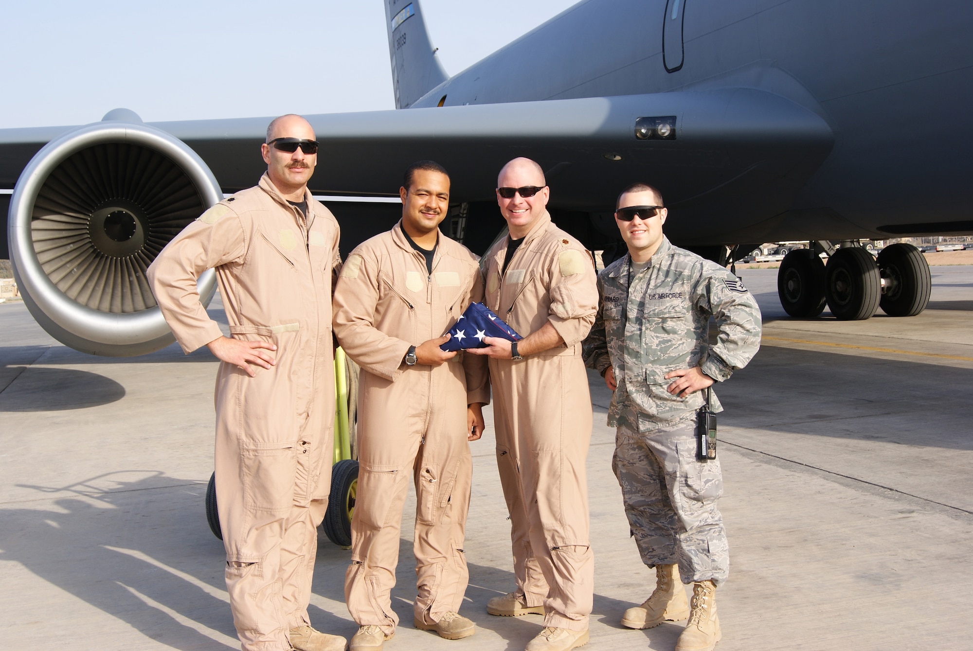 Lieutenant Colonel Michael J. Remualdo, Staff Sergeant Ronald W. Davis, Major Benjamin R. Evans and Staff Sgt. Christopher Howard pose in front of a 507th Air Refueling Wng KC-135R Stratotanker.  Remualdo, Davis and Evans are Air Force reservists from Tinker Air Force Base being recognized for two Air Force Association awards for superior airmanship during a combat air refueling mission in which an in-flight emergency forced them to land at Joint Base Balad.  Surprisingly, Sergeant Howard, with the Oklahoma Air National Guard was on duty at that base as transient alert maintenance and assisted with on-ground repairs. 